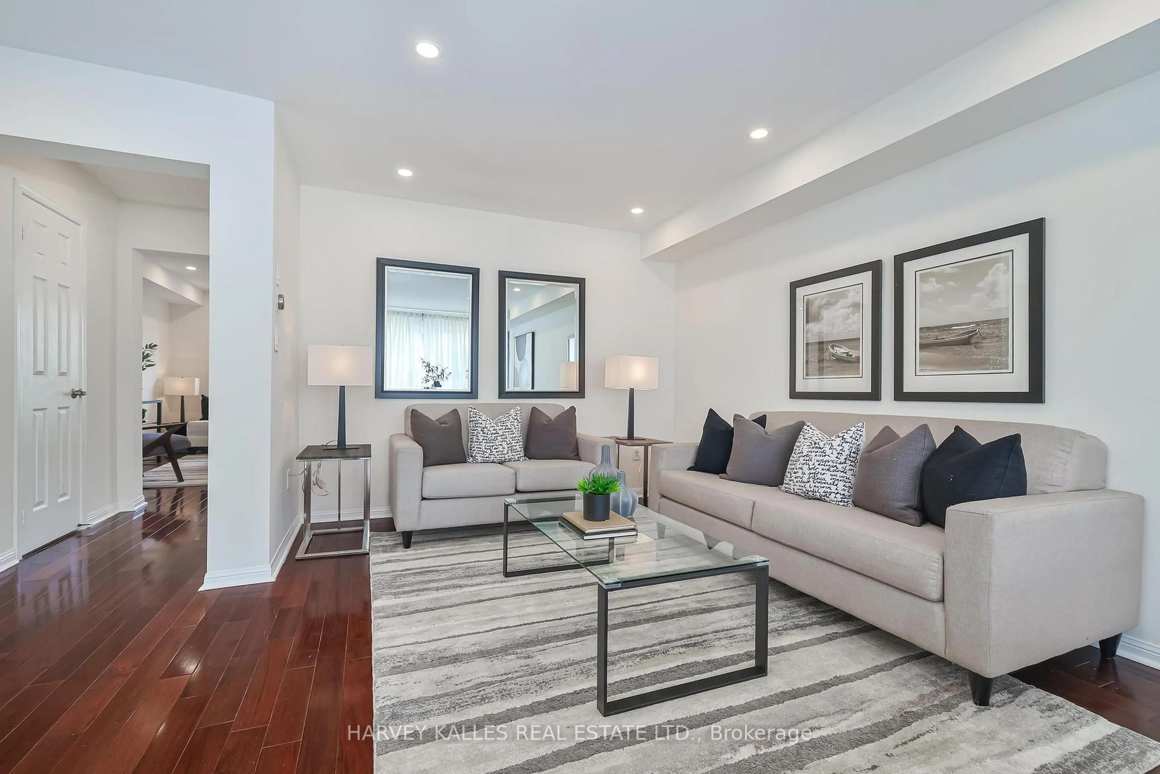 Living room with furniture, wood/laminate floor for 5980 Whitehorn Ave #30, Mississauga Ontario L5V 2Y2