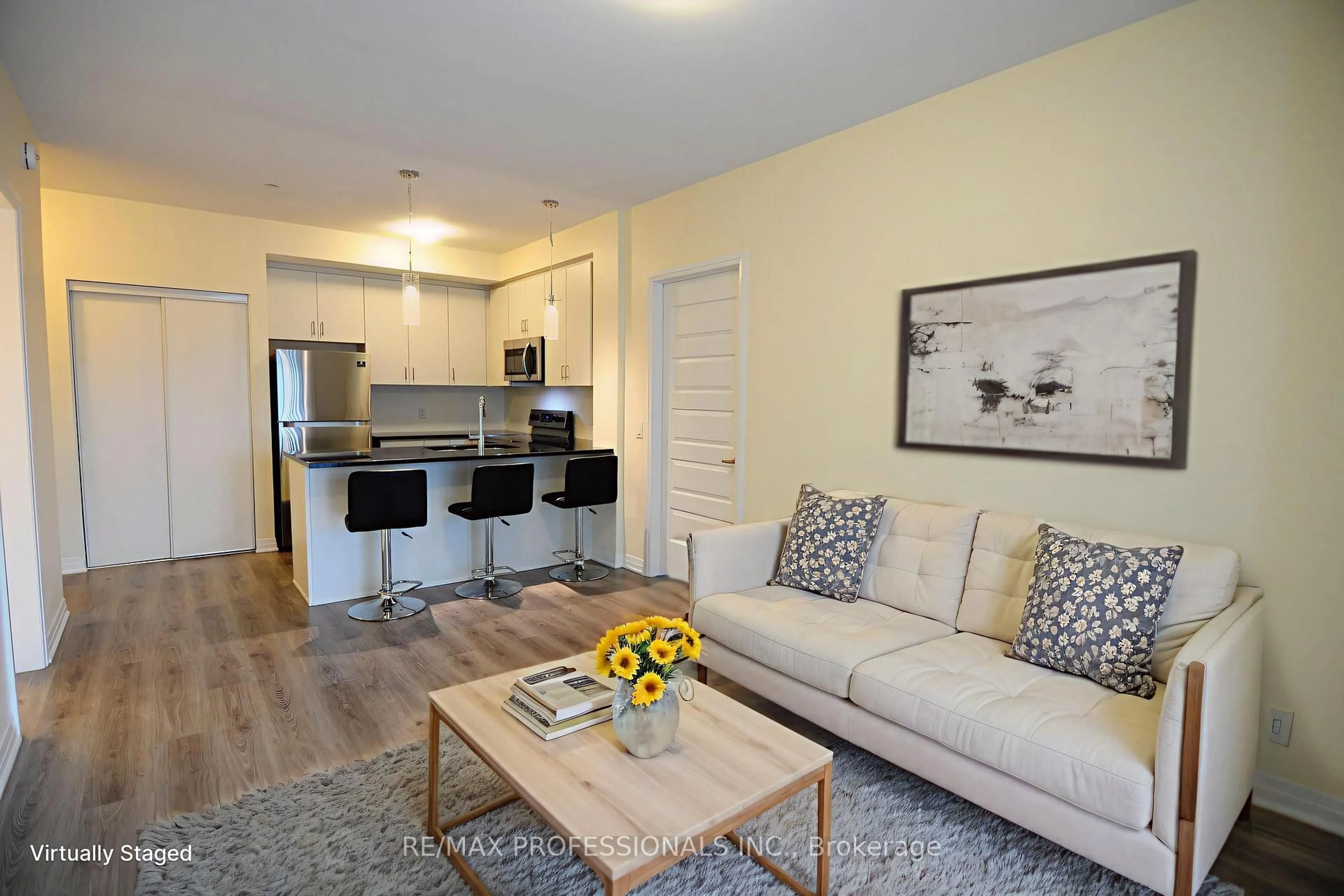 Living room with furniture, wood/laminate floor for 128 Grovewood Common #210, Oakville Ontario L6H 0X3