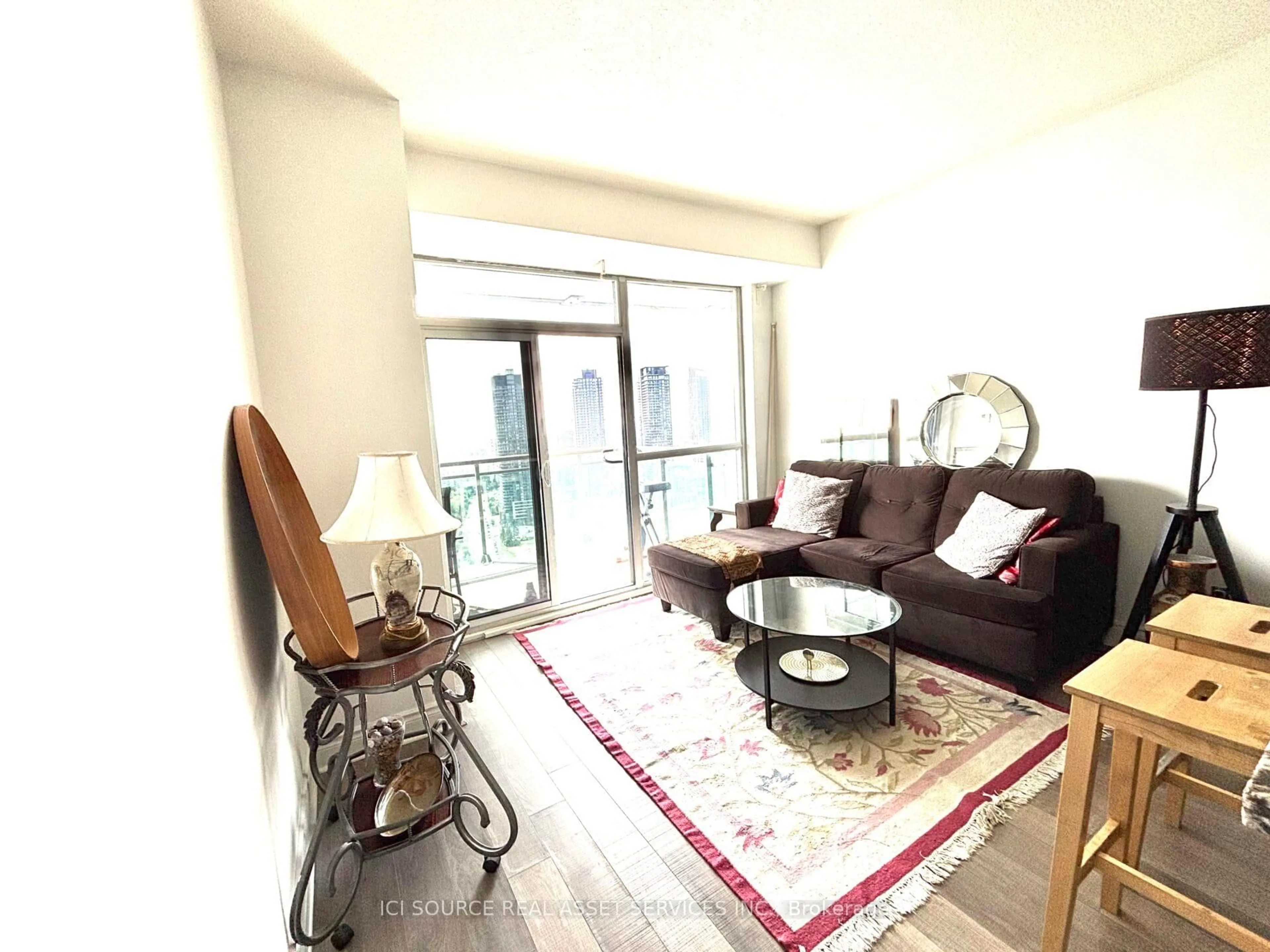 Living room with furniture, wood/laminate floor for 16 Brookers Lane #3008, Toronto Ontario M8V 0A5