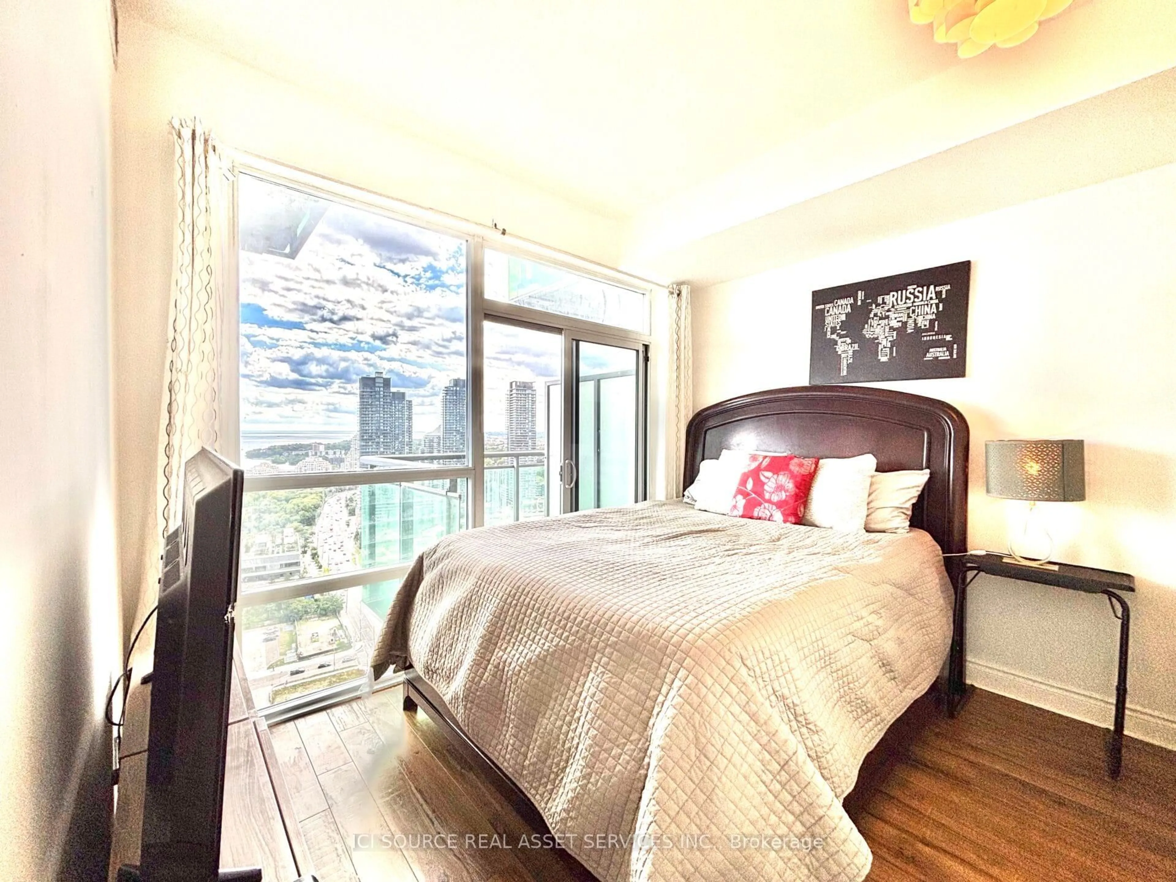 Bedroom with bed, wood/laminate floor for 16 Brookers Lane #3008, Toronto Ontario M8V 0A5