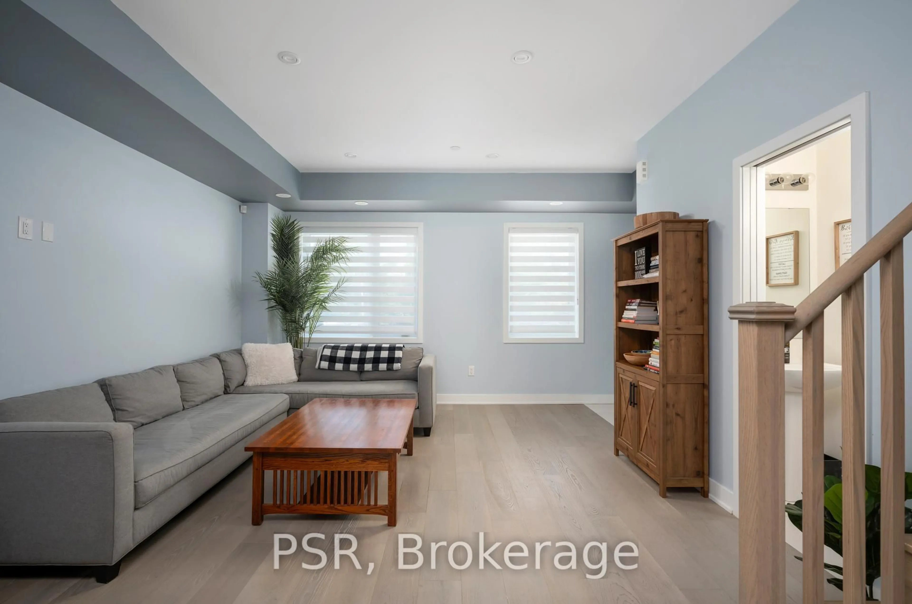 Living room with furniture, wood/laminate floor for 91 Frederick Tisdale Dr, Toronto Ontario M3K 0C6