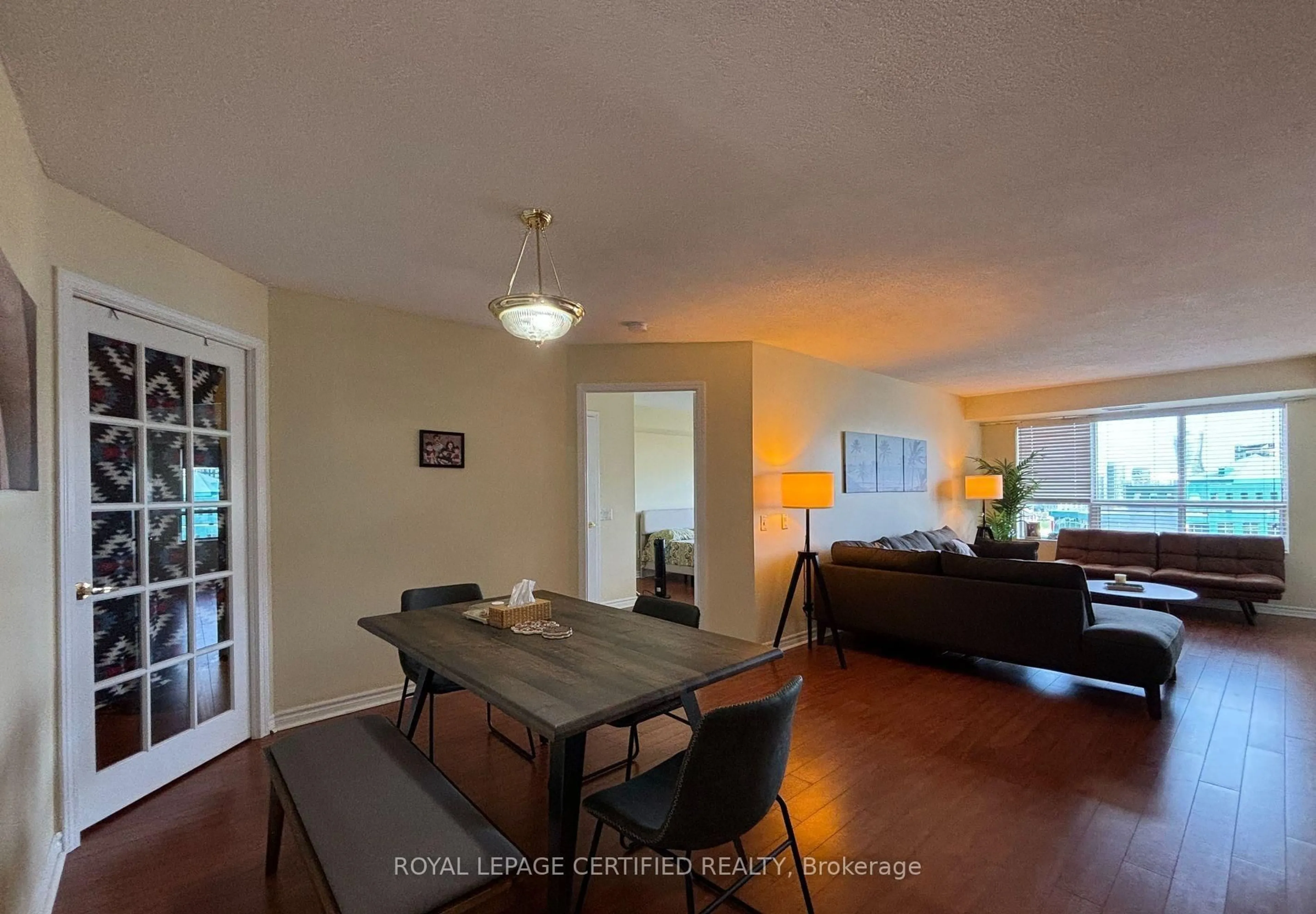 Dining room, wood/laminate floor for 25 Kingsbridge Garden Circ #1526, Mississauga Ontario L5R 3Z5