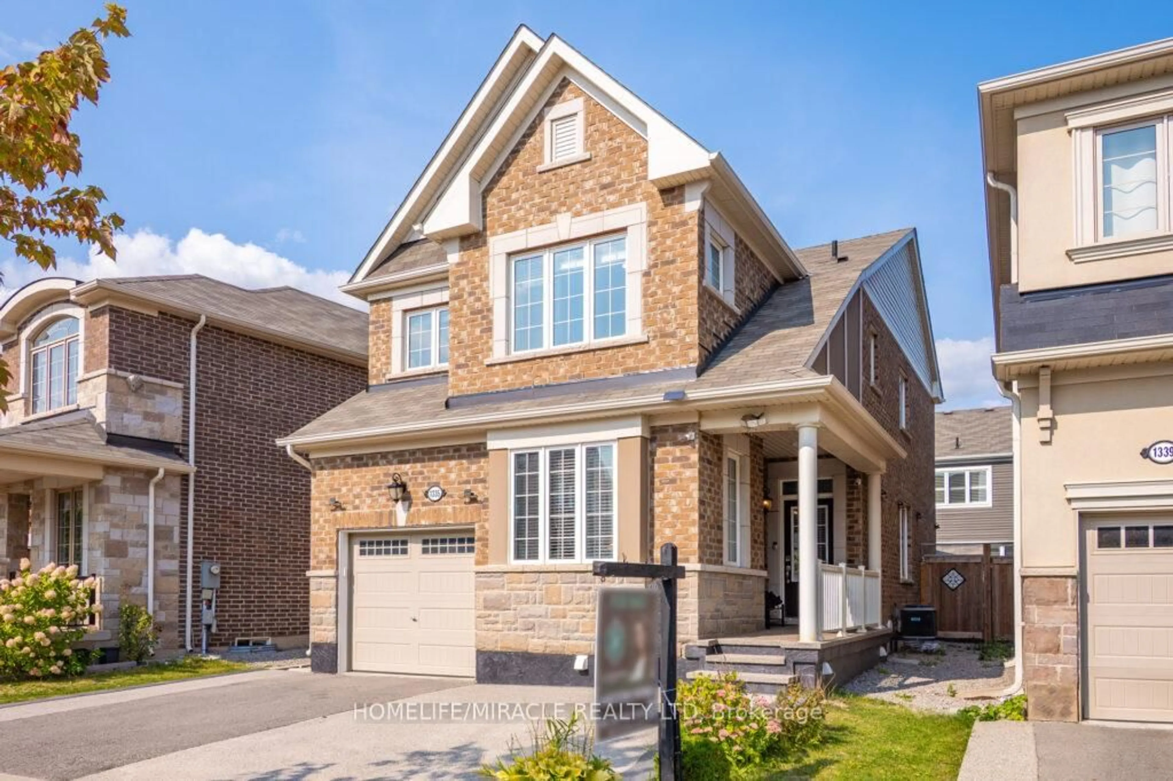 Home with brick exterior material, street for 1335 Rose Way, Milton Ontario L9E 1M5