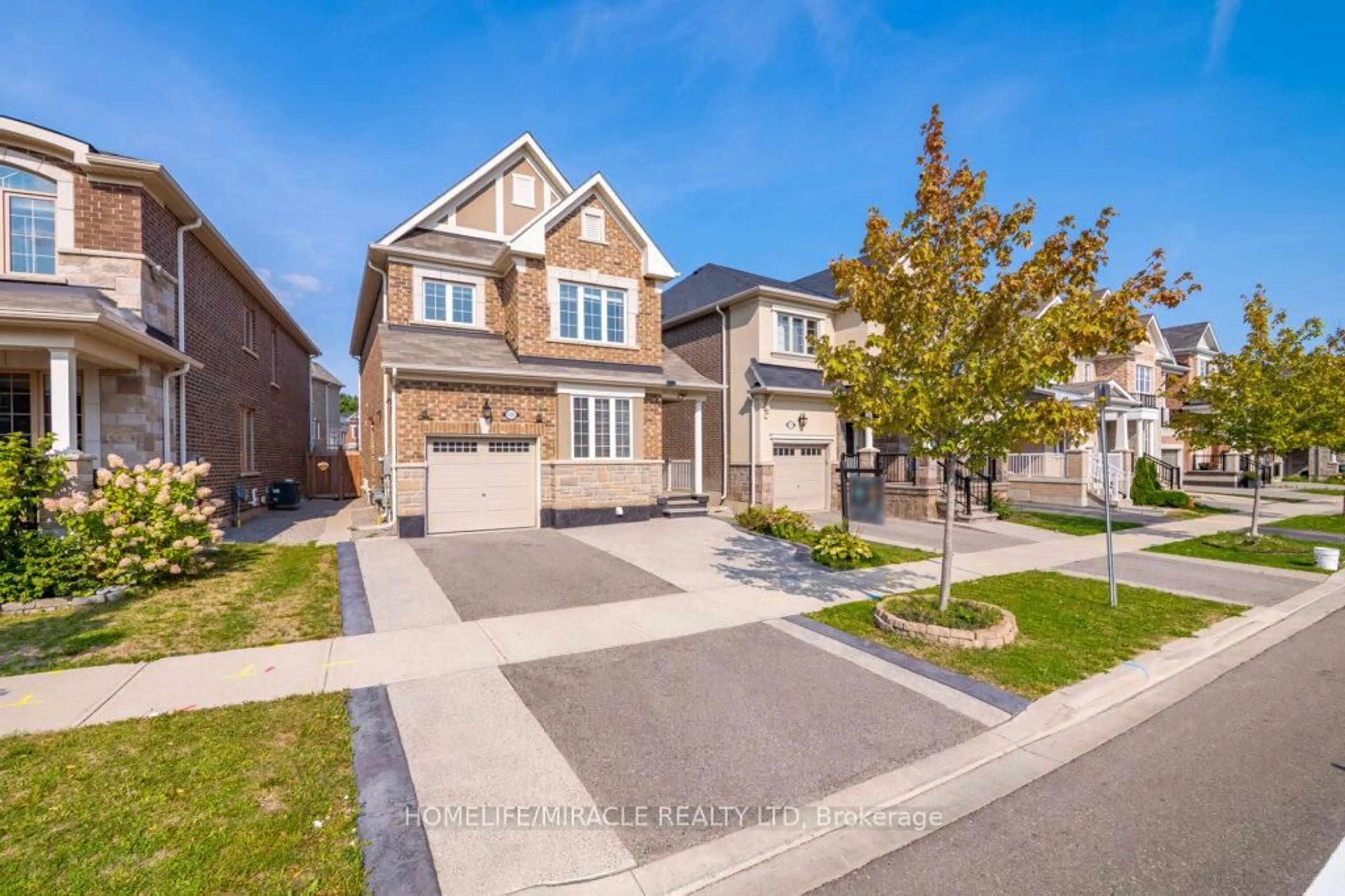 Home with brick exterior material, street for 1335 Rose Way, Milton Ontario L9E 1M5