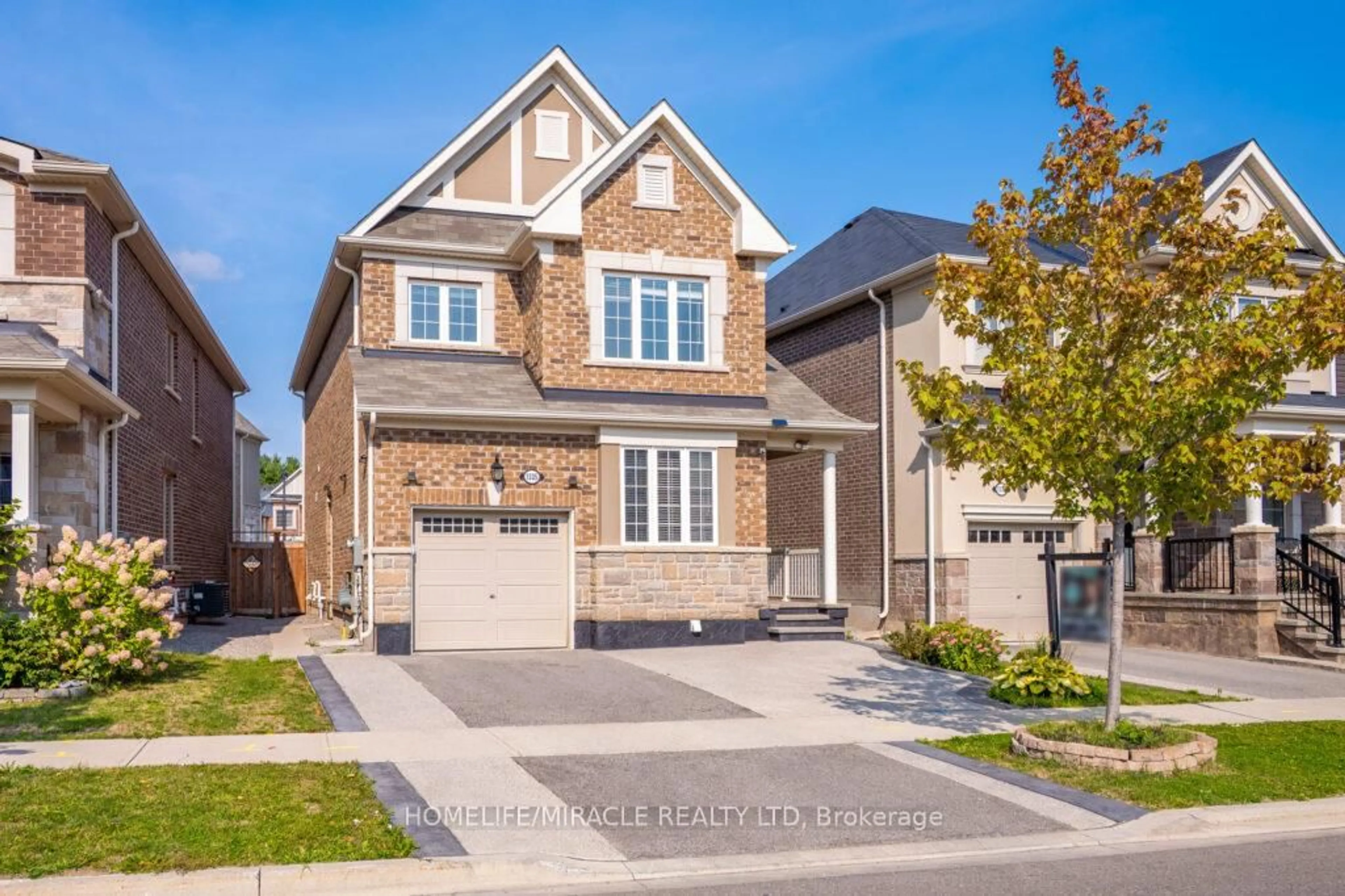 Home with brick exterior material, street for 1335 Rose Way, Milton Ontario L9E 1M5
