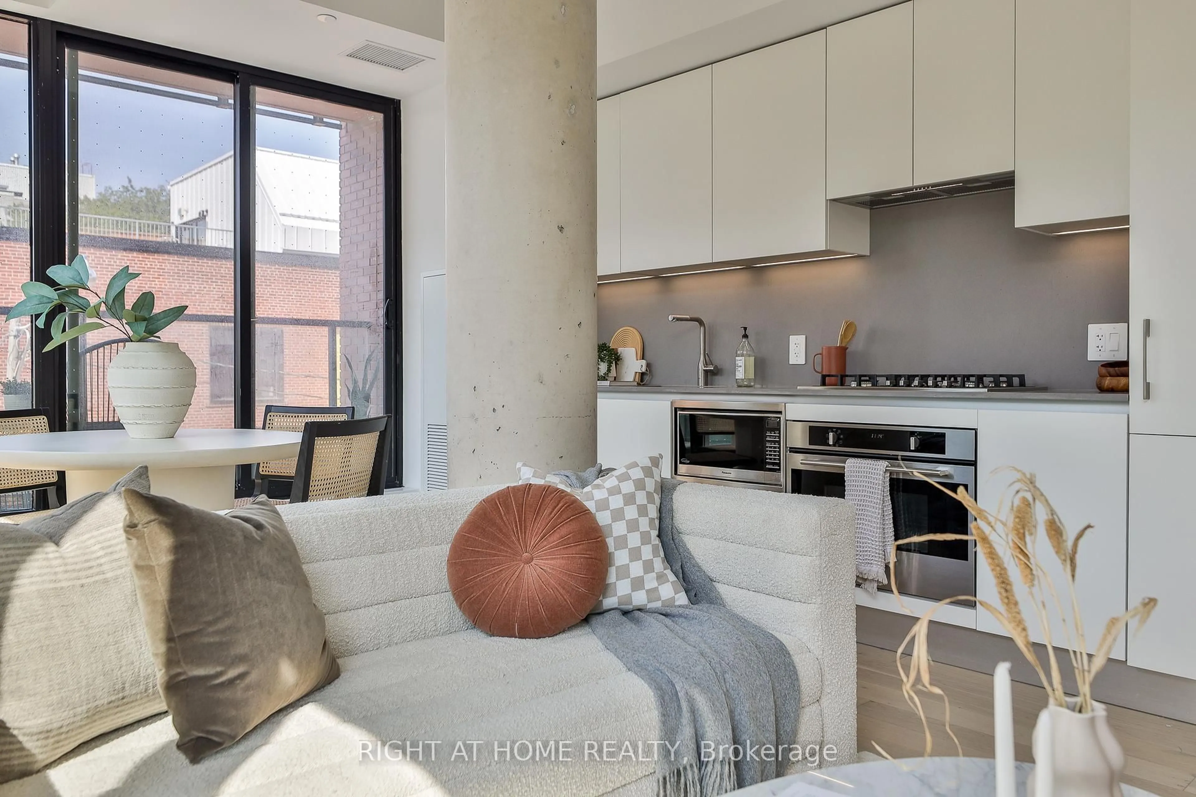 Open concept kitchen, cement floor for 2720 Dundas St #208, Toronto Ontario M6P 0C3