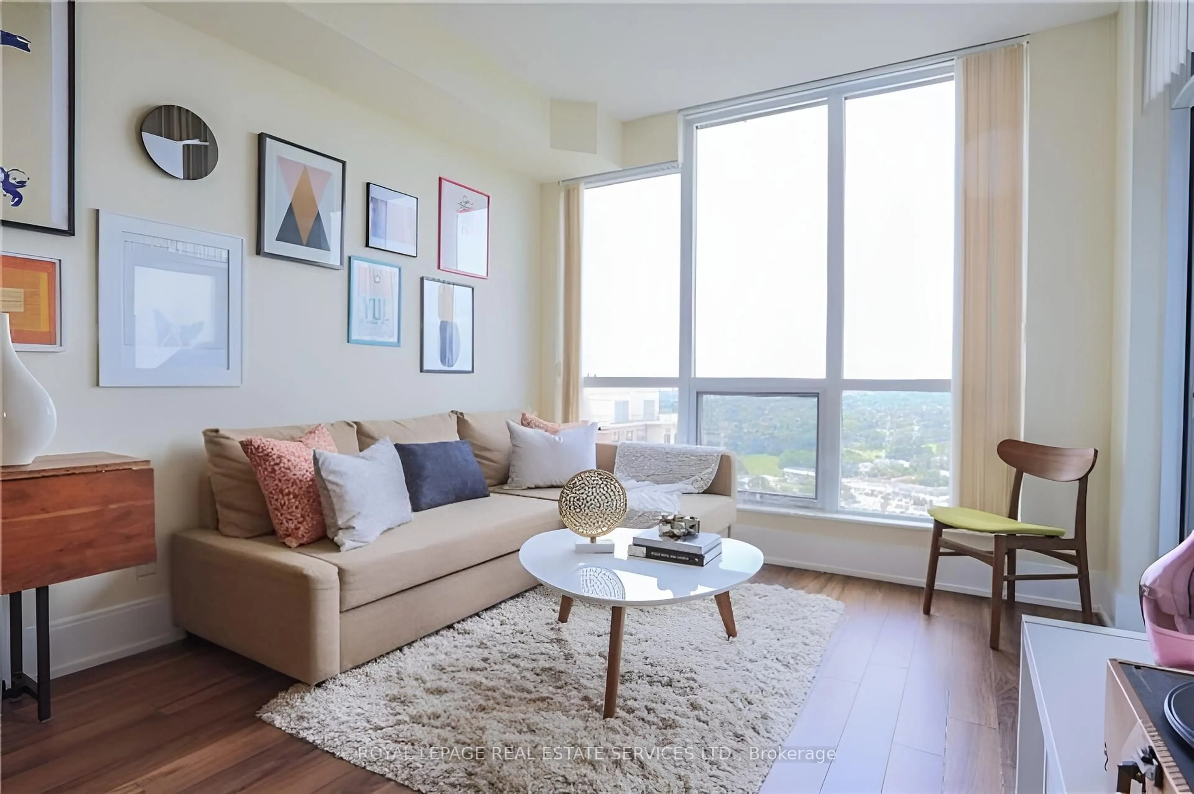 Living room with furniture, wood/laminate floor for 15 Viking Lane #2305, Toronto Ontario M9B 0A4