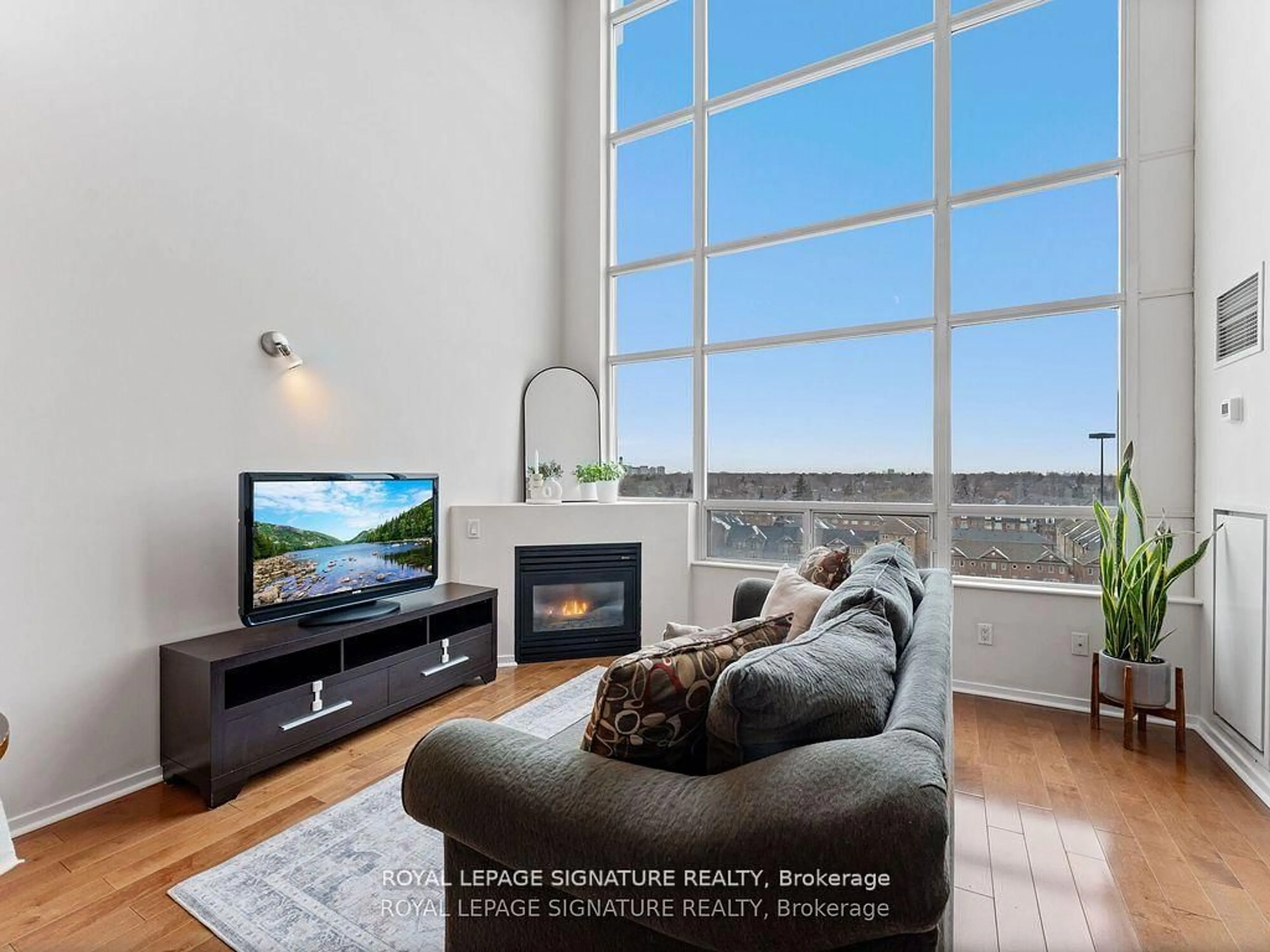 Living room with furniture, wood/laminate floor for 200 Manitoba St #620, Toronto Ontario M8Y 3Y9