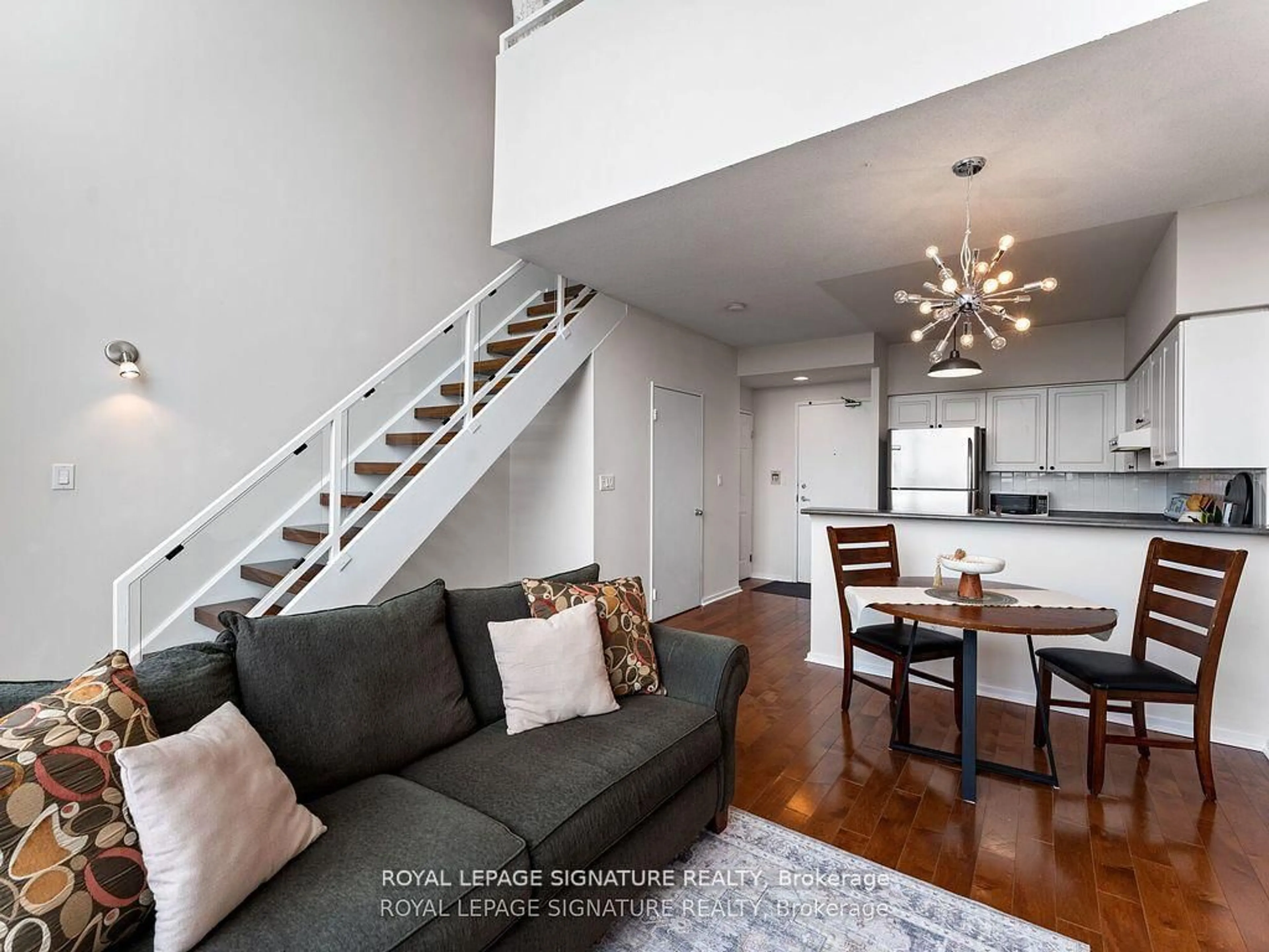 Living room with furniture, wood/laminate floor for 200 Manitoba St #620, Toronto Ontario M8Y 3Y9