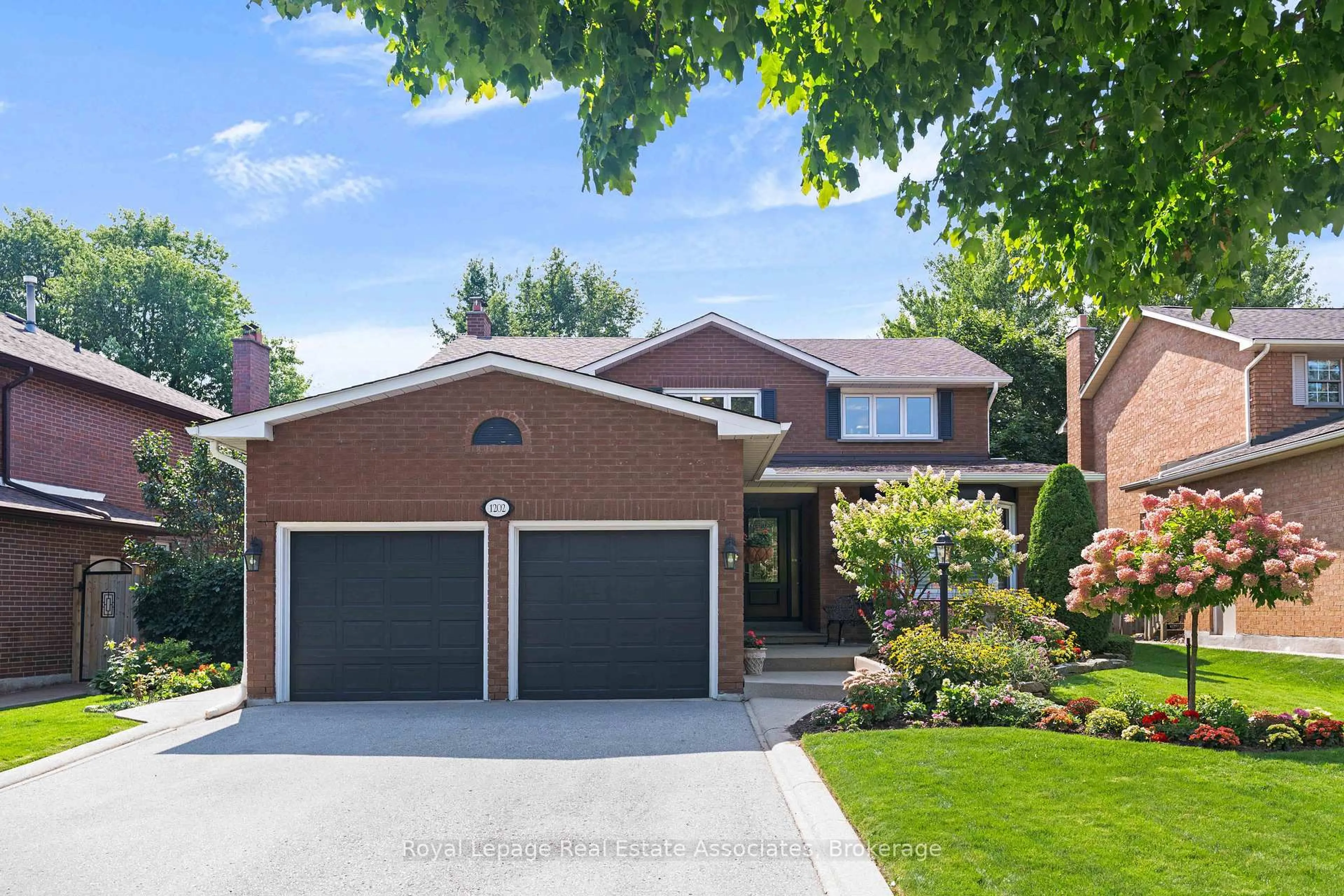 Home with brick exterior material, street for 1202 Monks Passage, Oakville Ontario L6M 1M2