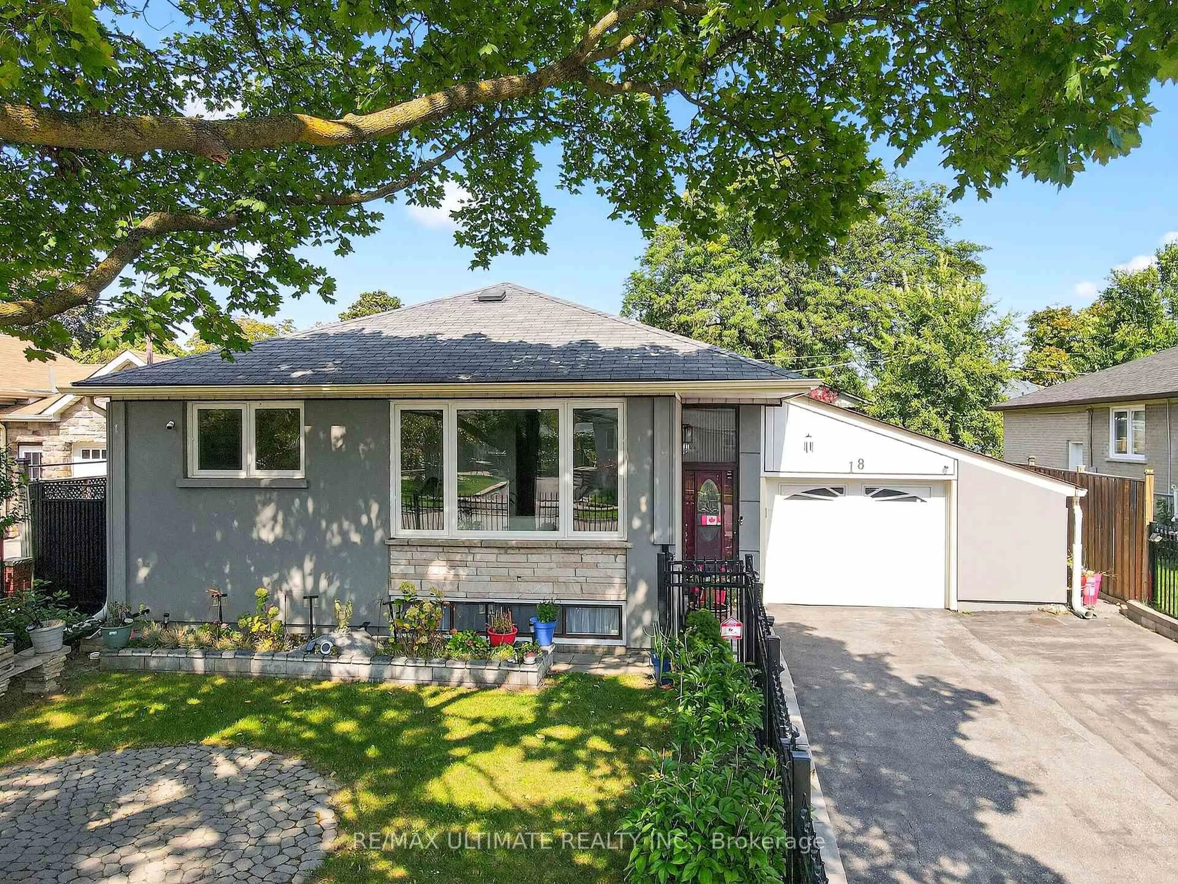 Home with vinyl exterior material, street for 18 Courtwright Rd, Toronto Ontario M9C 4B4