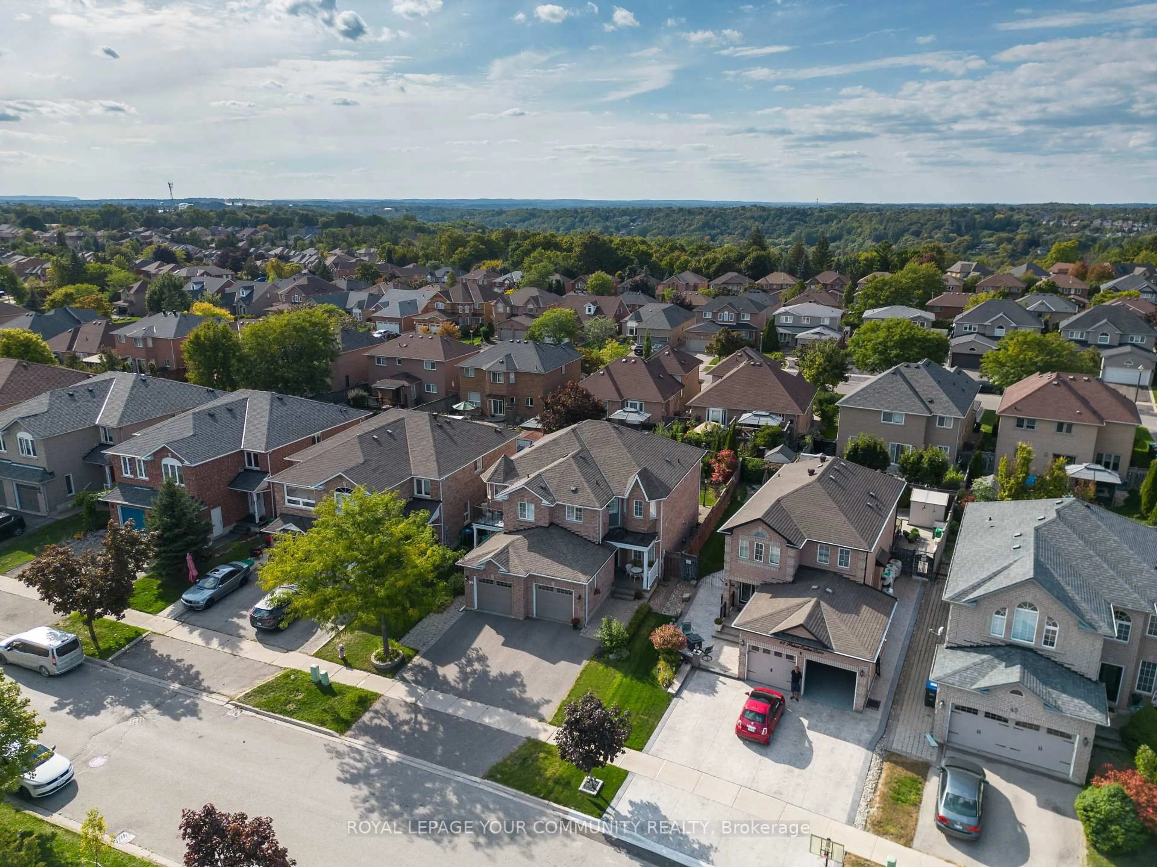 A pic from outside/outdoor area/front of a property/back of a property/a pic from drone, street for 41 Hubert Corless Dr, Caledon Ontario L7E 1W7