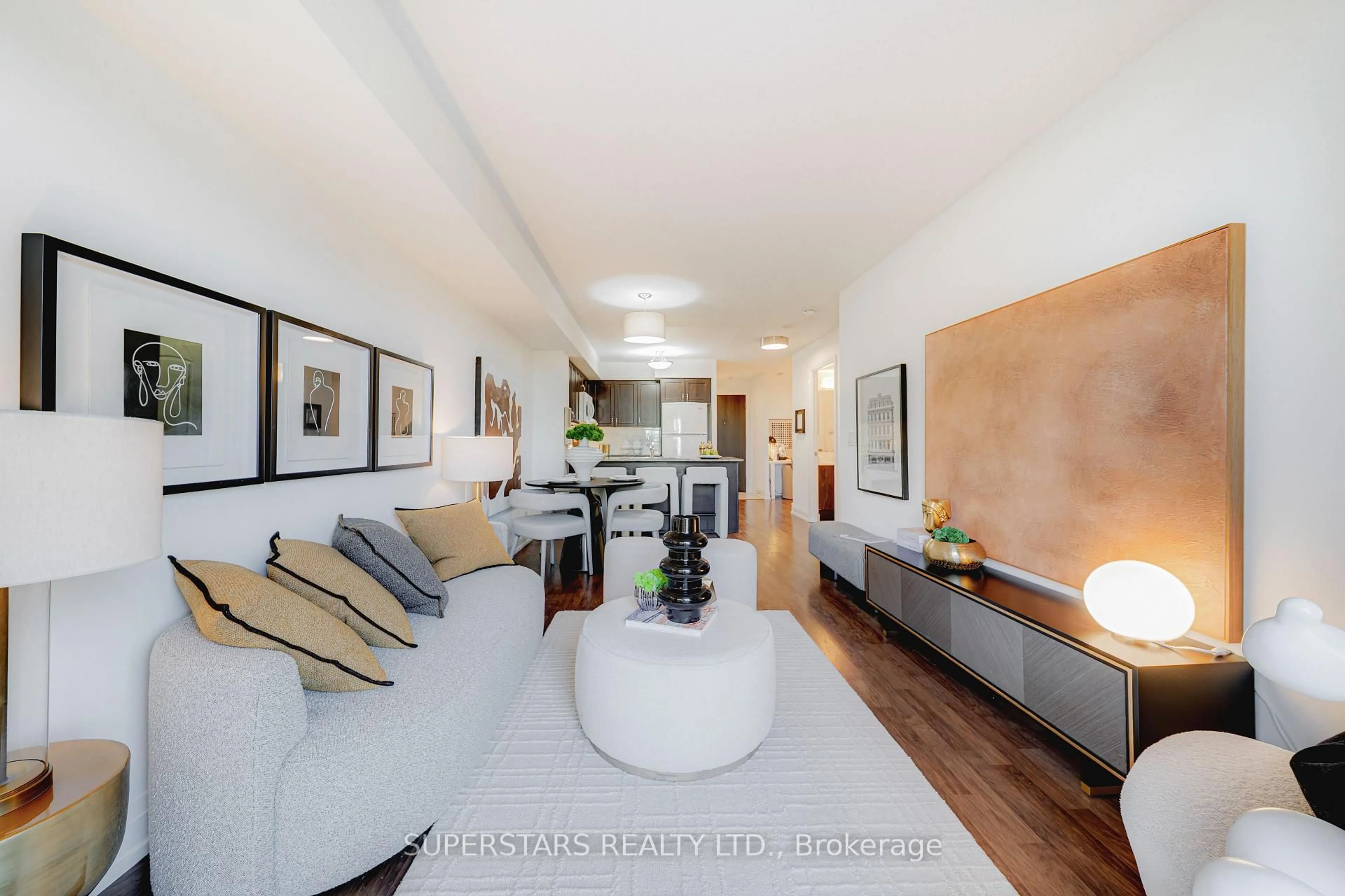 Living room with furniture, wood/laminate floor for 55 De Boers Dr #502, Toronto Ontario M3J 0G5