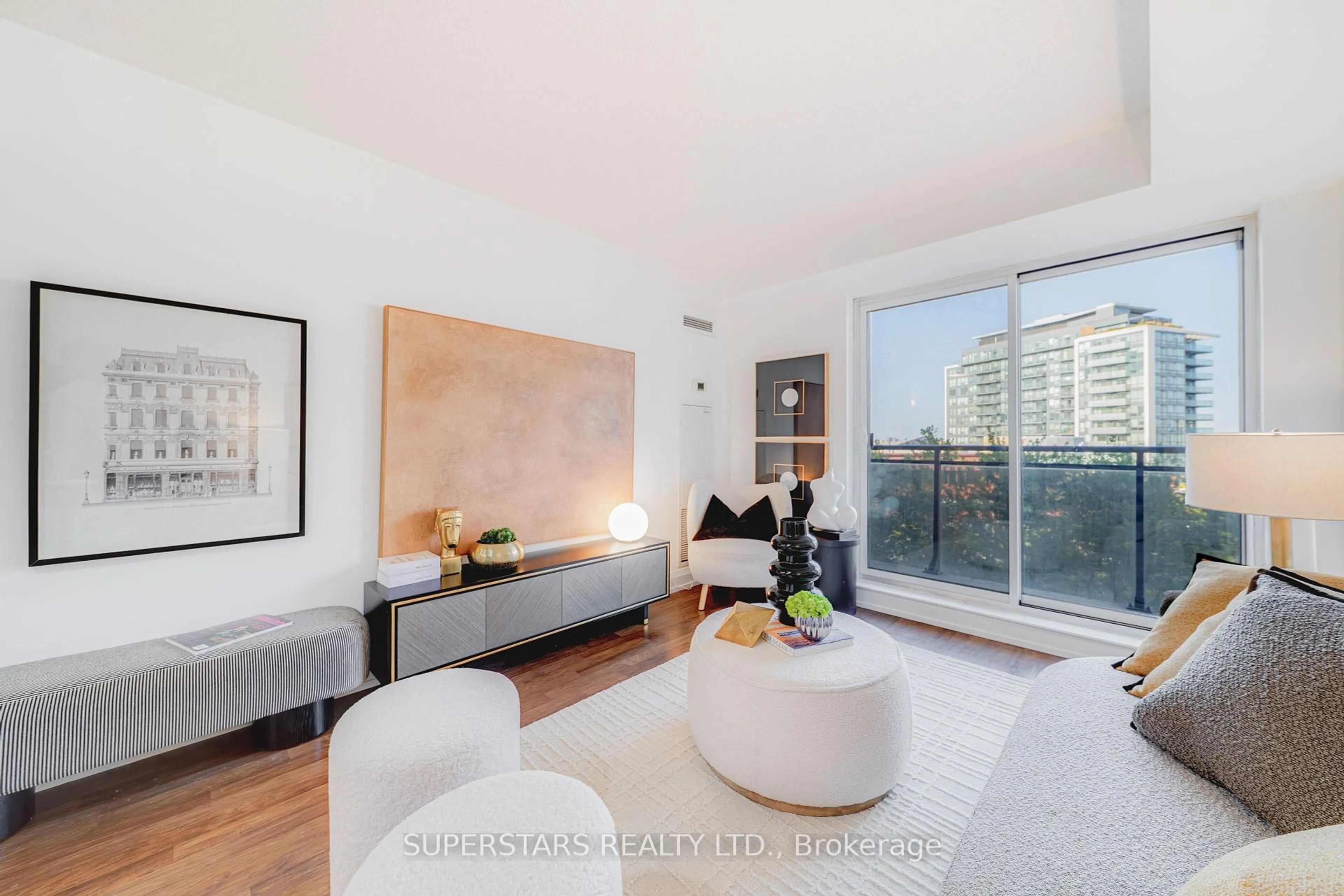 Living room with furniture, wood/laminate floor for 55 De Boers Dr #502, Toronto Ontario M3J 0G5