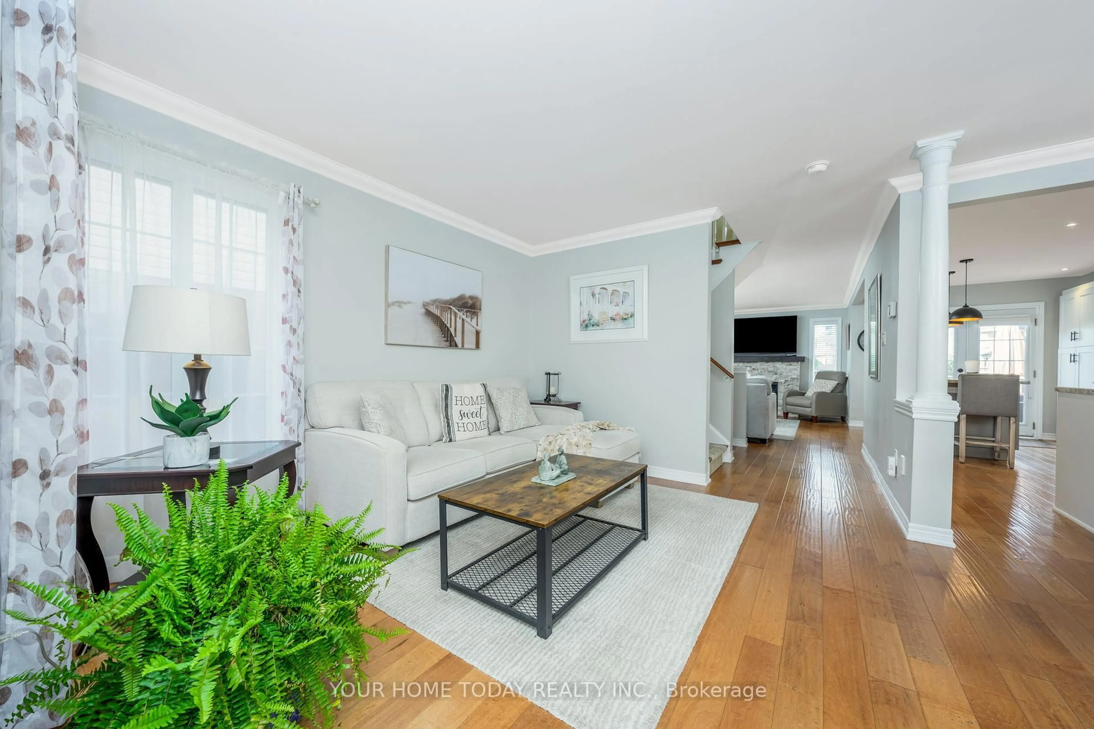 Living room with furniture, wood/laminate floor for 12 Russell St, Halton Hills Ontario L7G 5Y7
