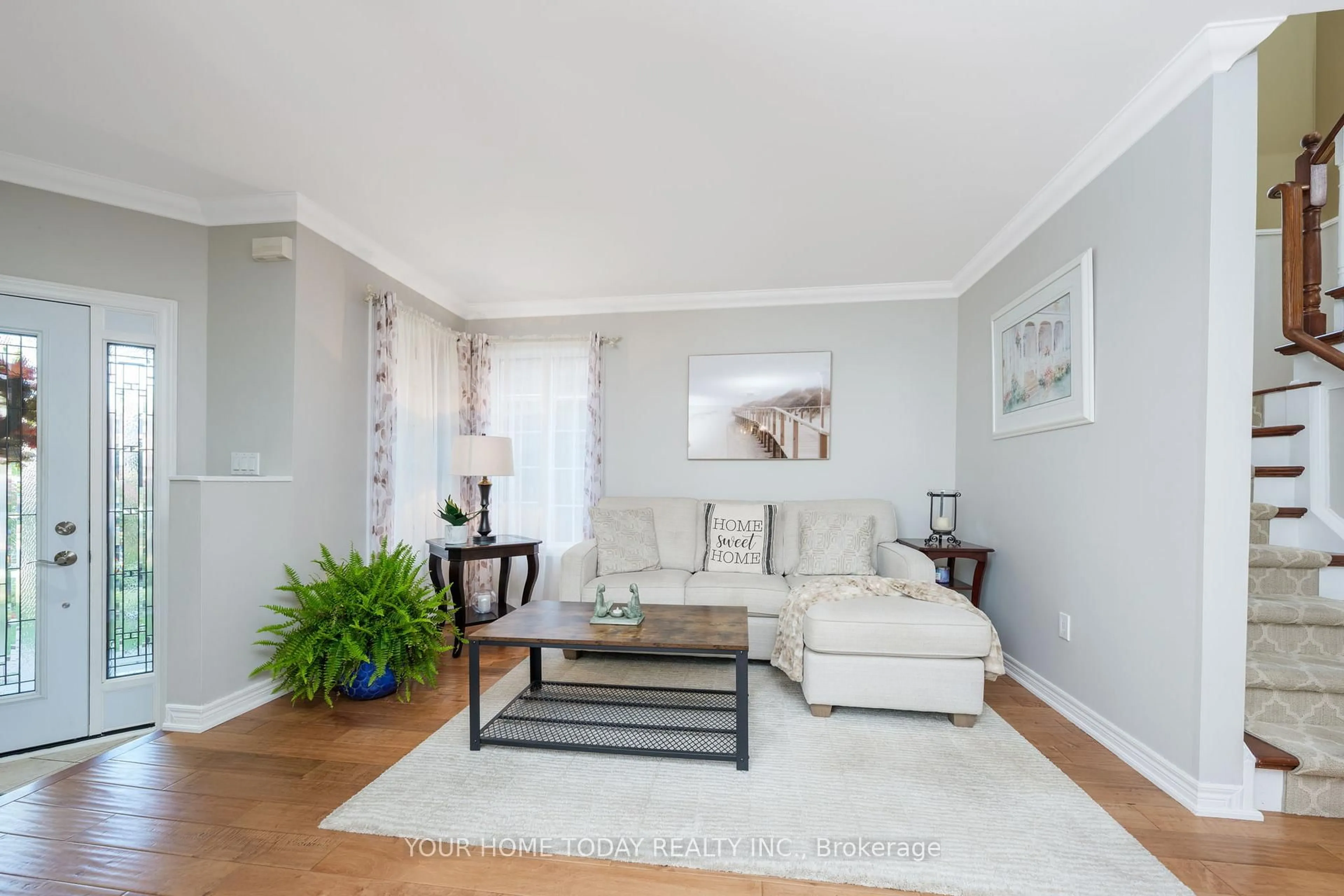 Living room with furniture, wood/laminate floor for 12 Russell St, Halton Hills Ontario L7G 5Y7