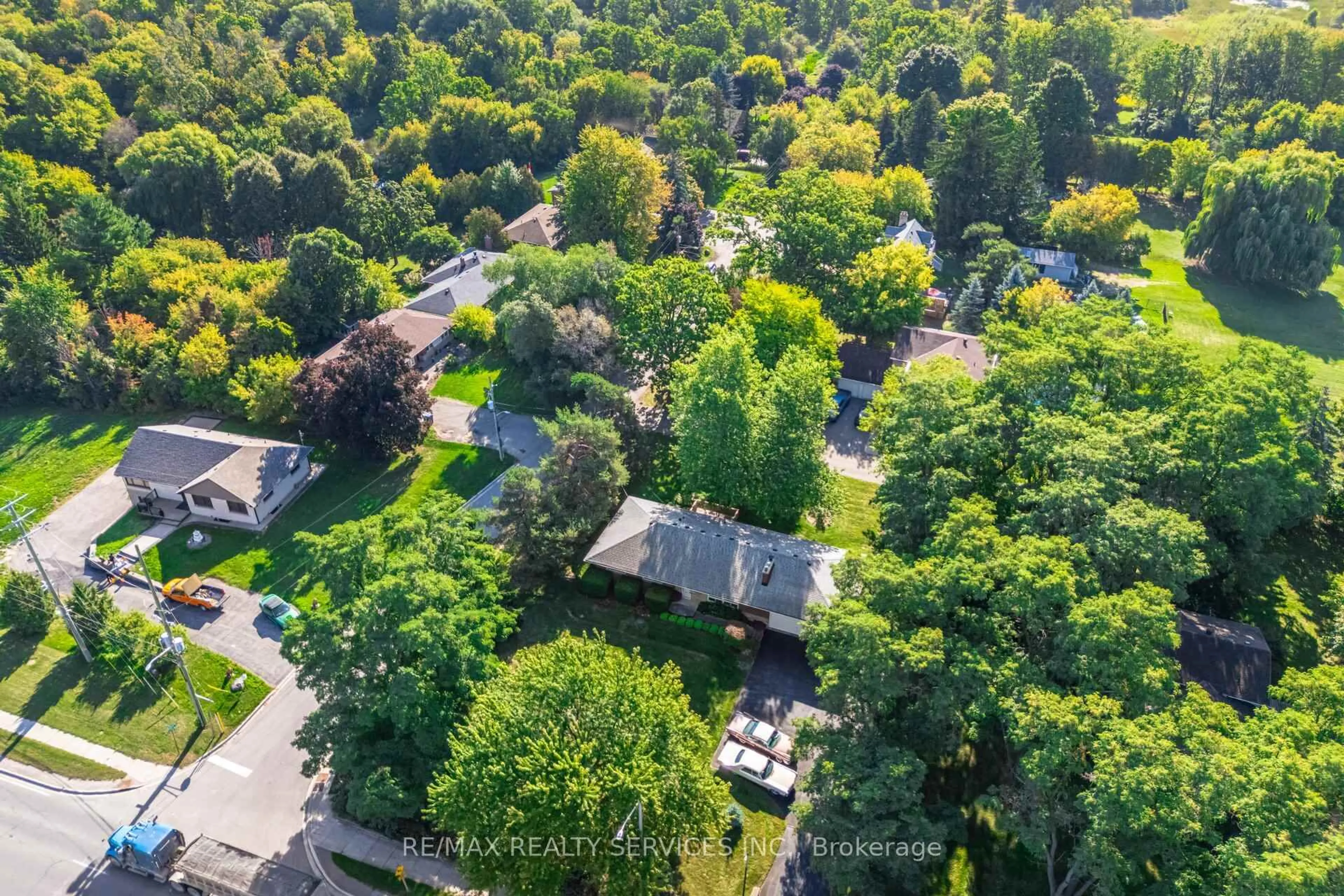 A pic from outside/outdoor area/front of a property/back of a property/a pic from drone, forest/trees view for 3173 Mayfield Rd, Brampton Ontario L6Z 4P9