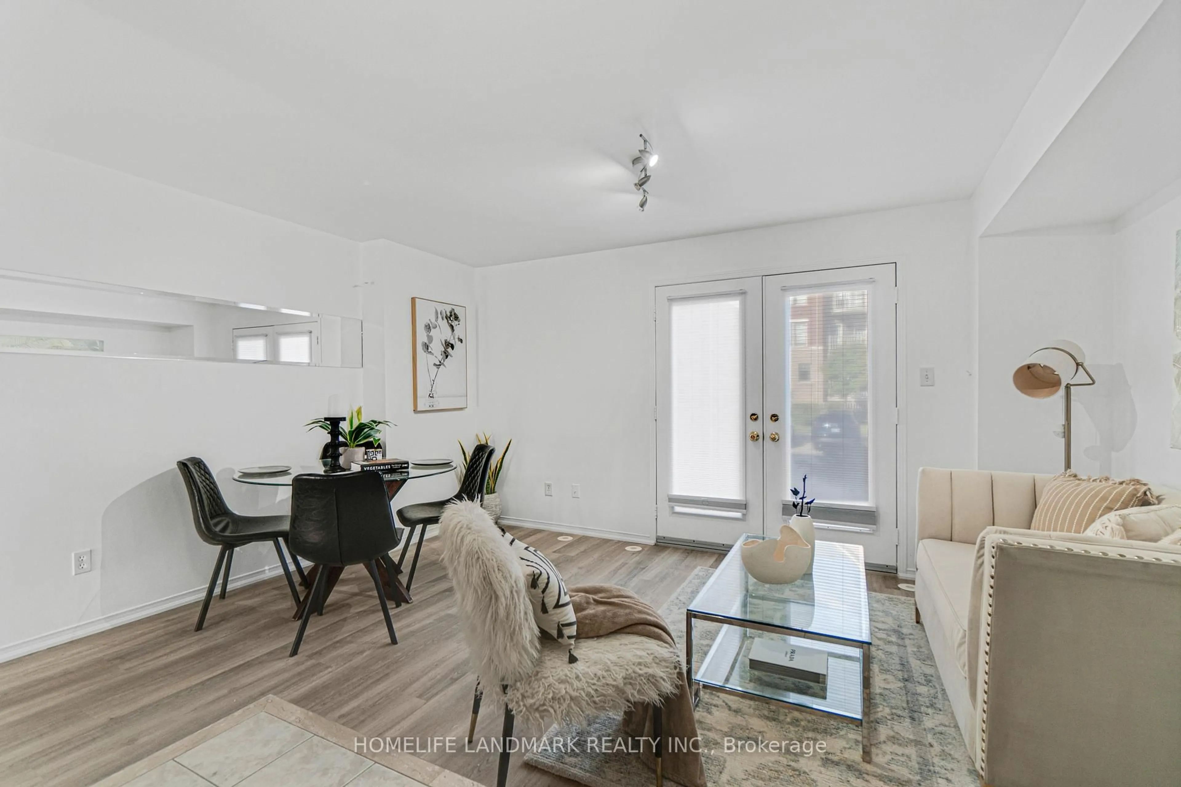 Living room with furniture, wood/laminate floor for 5025 Ninth Line #8, Mississauga Ontario L5M 0E9