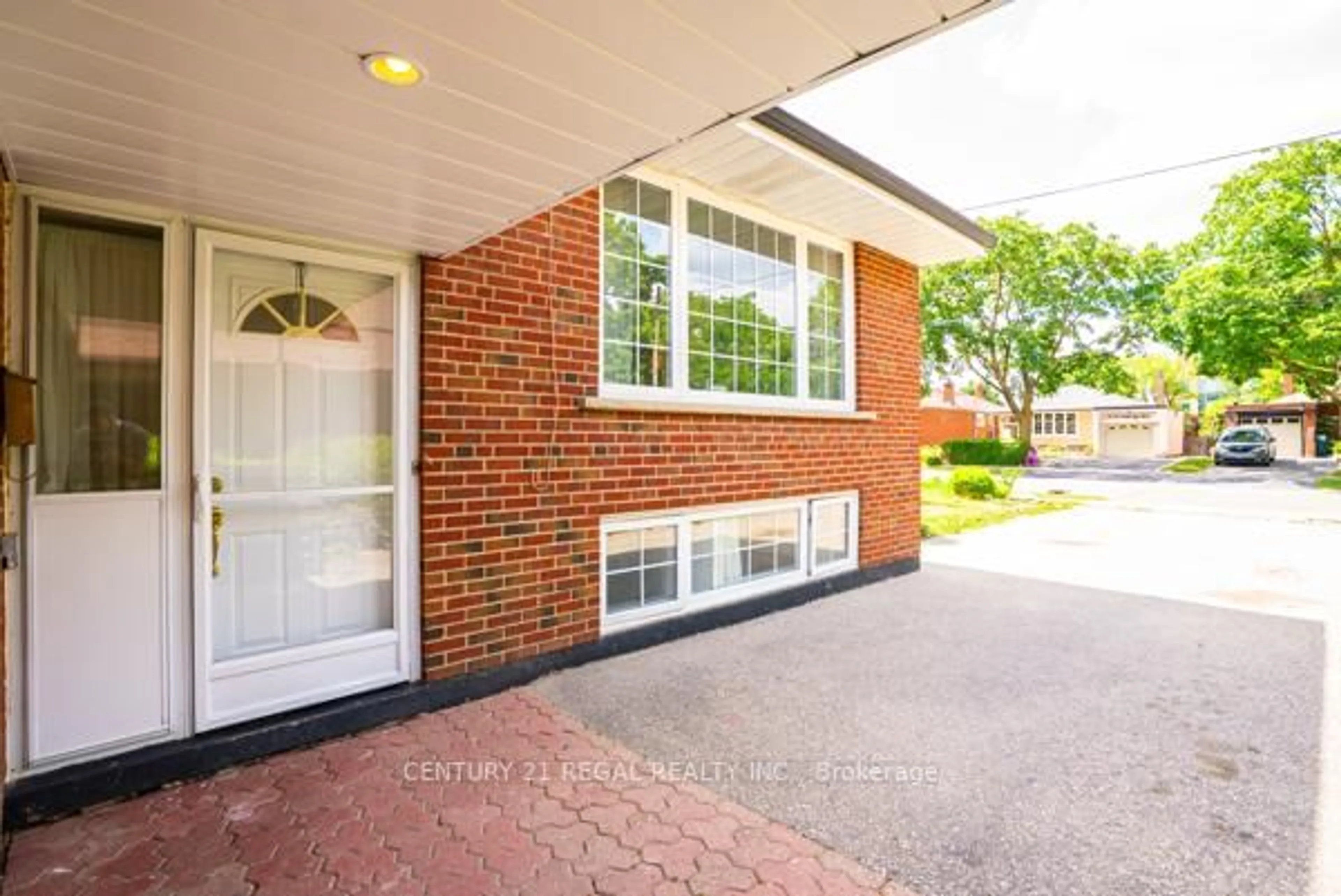 Home with brick exterior material, street for 97 Westhampton Dr, Toronto Ontario M9R 1Y1