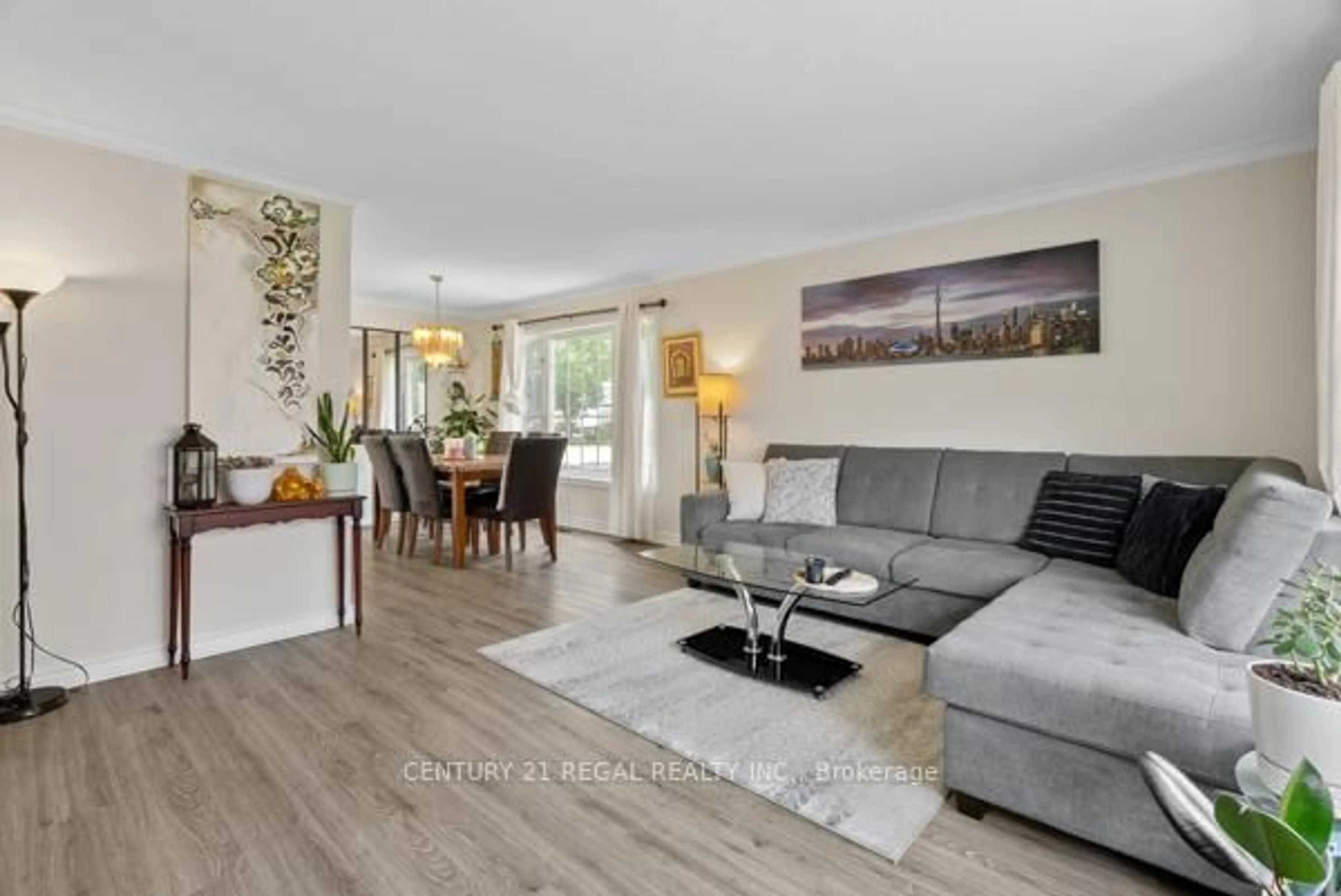 Living room with furniture, wood/laminate floor for 97 Westhampton Dr, Toronto Ontario M9R 1Y1