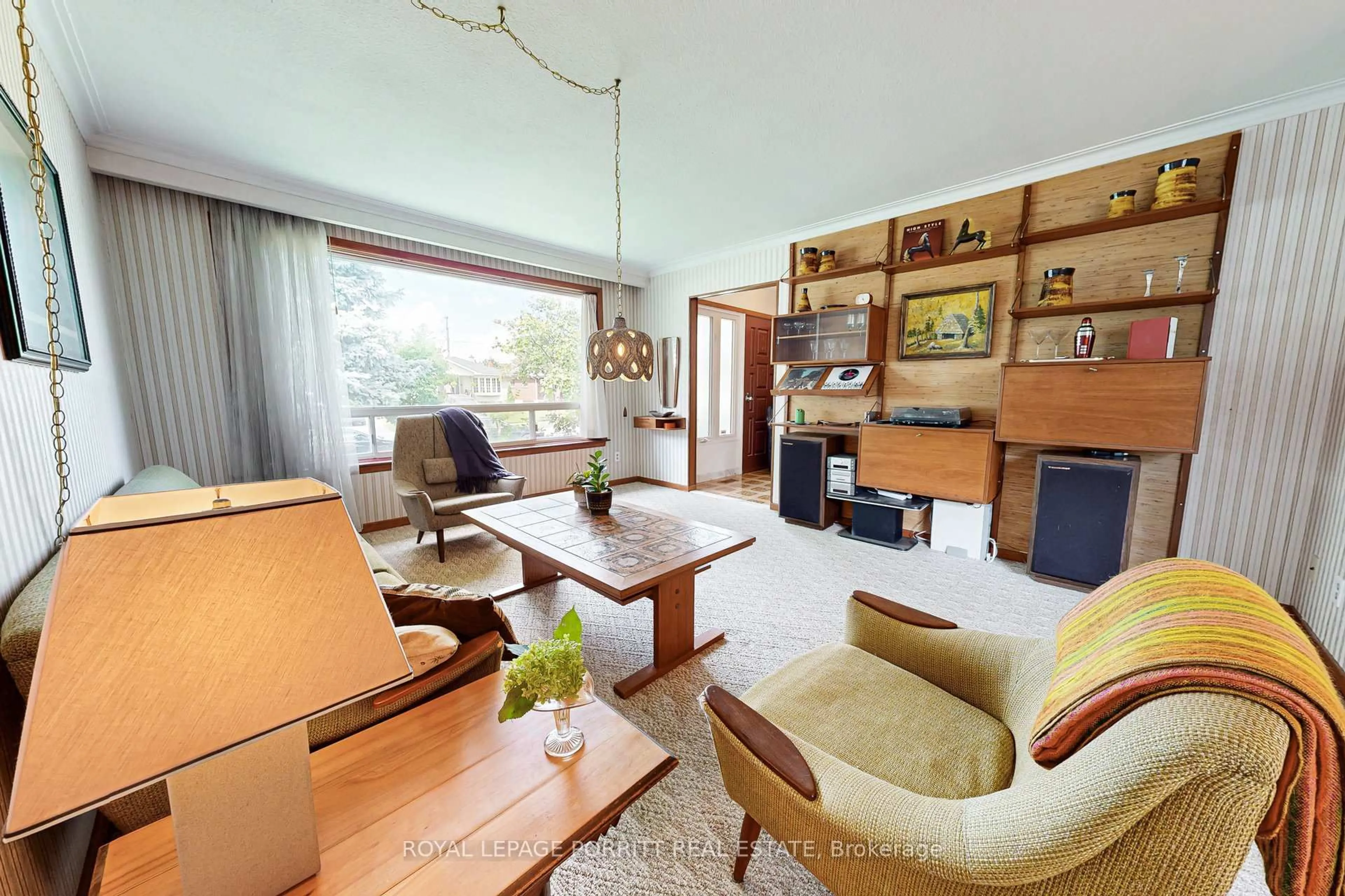 Living room with furniture, wood/laminate floor for 26 Richland Cres, Toronto Ontario M9C 4C2