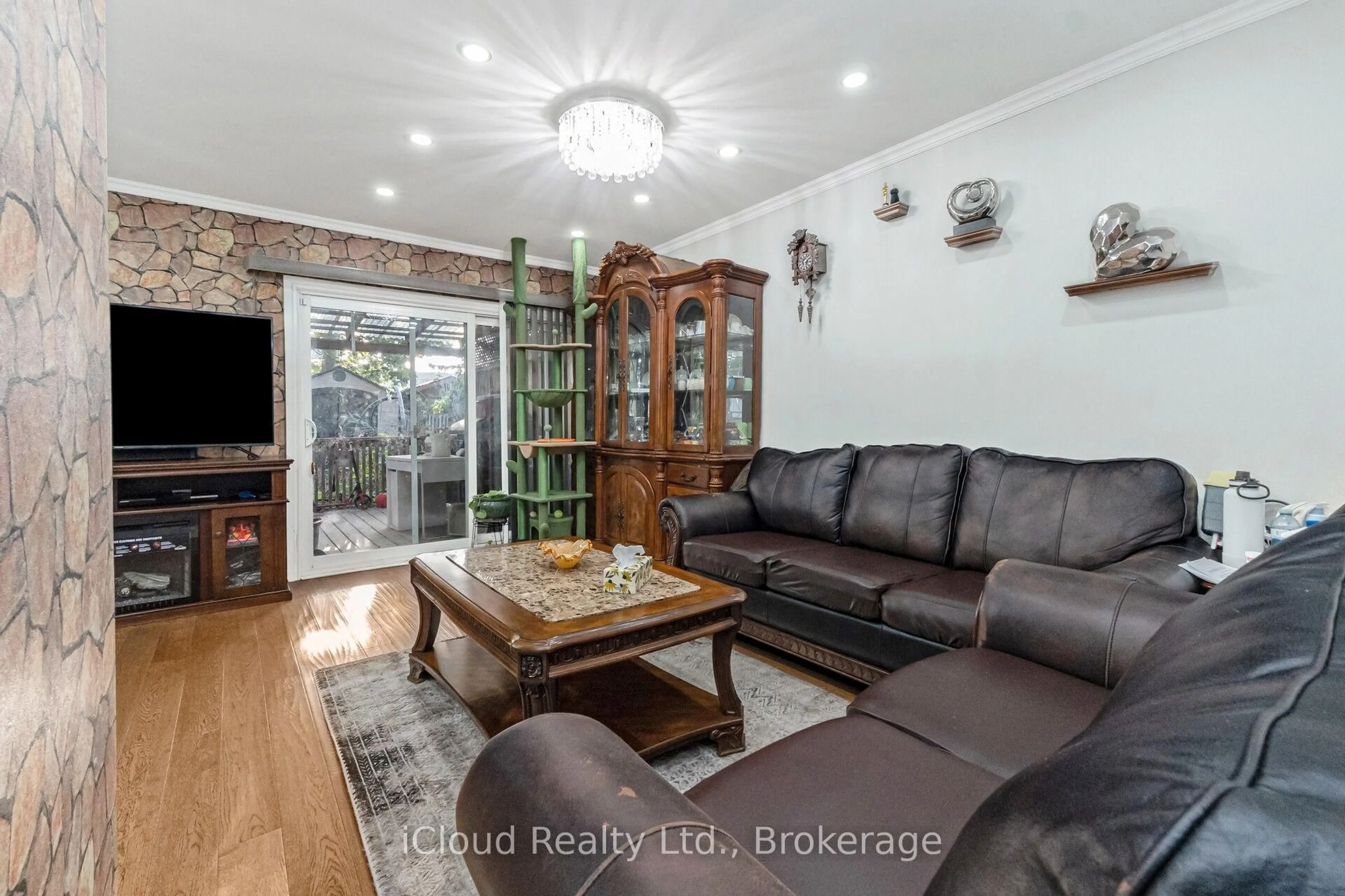 Living room with furniture, wood/laminate floor for 40 Rabbit Lane #10, Toronto Ontario M9B 5S6