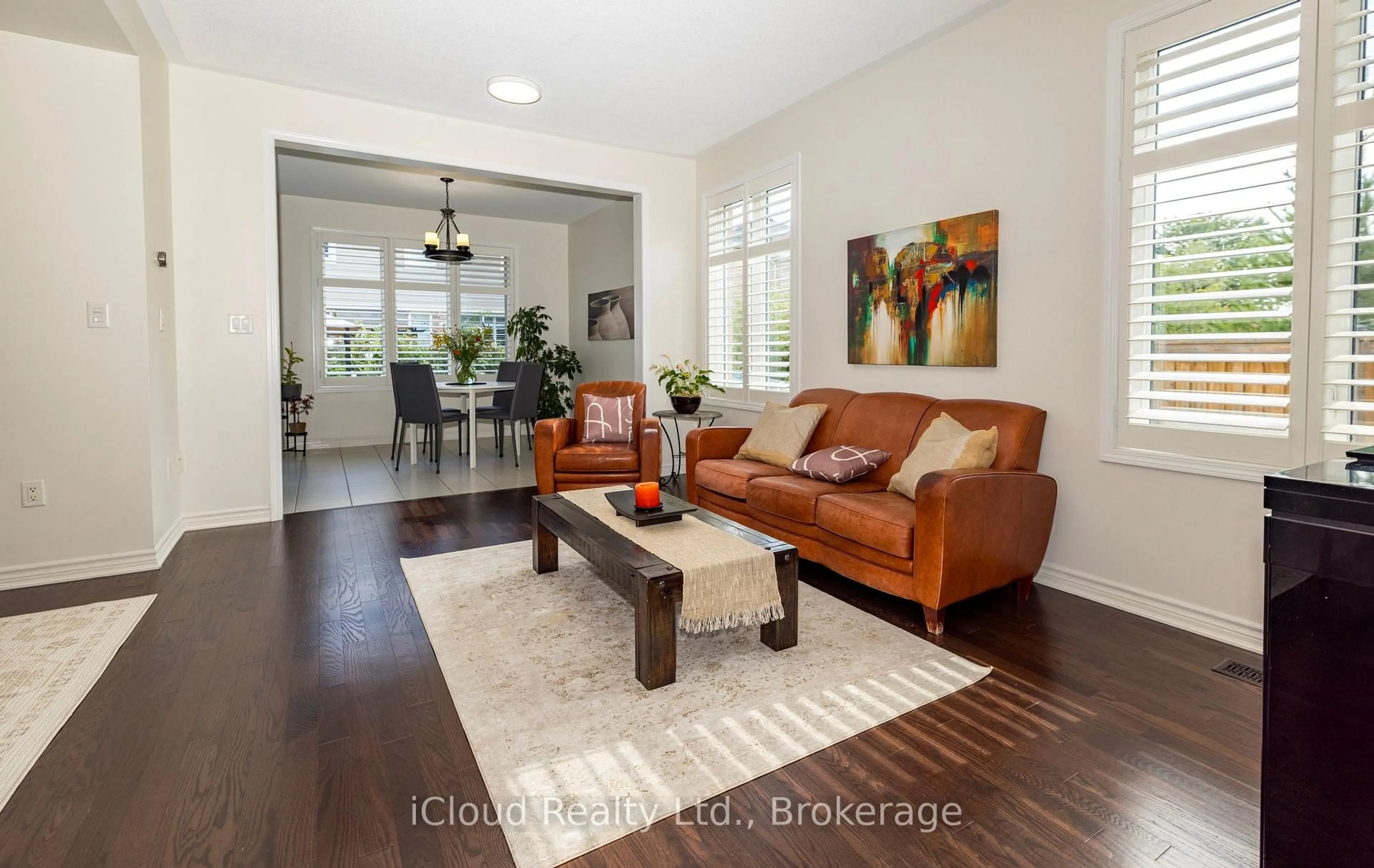 Living room with furniture, wood/laminate floor for 954 Penson Cres, Milton Ontario L9T 8Z7