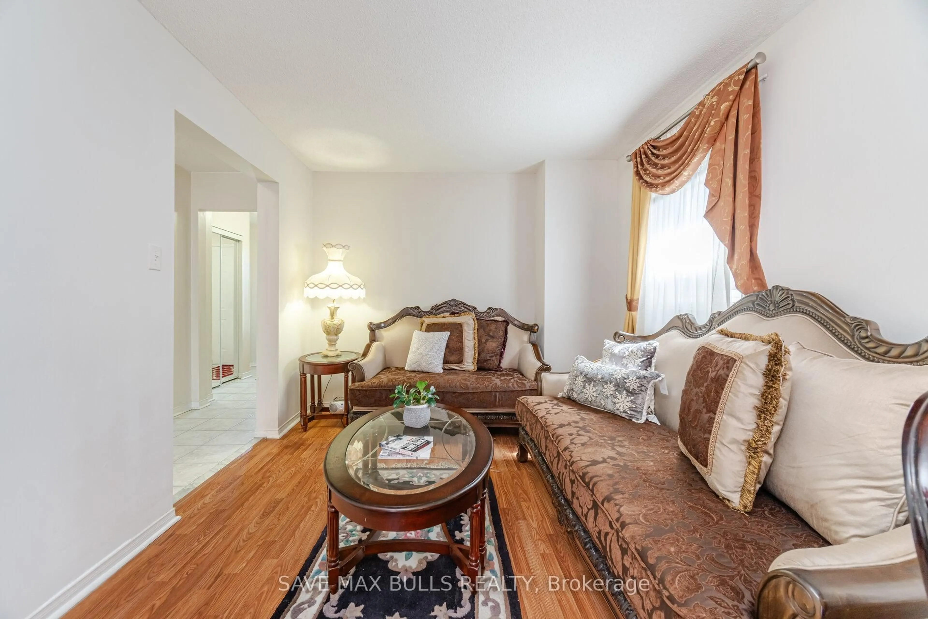 Living room with furniture, wood/laminate floor for 146 Toba Cres, Brampton Ontario L6Z 4R9