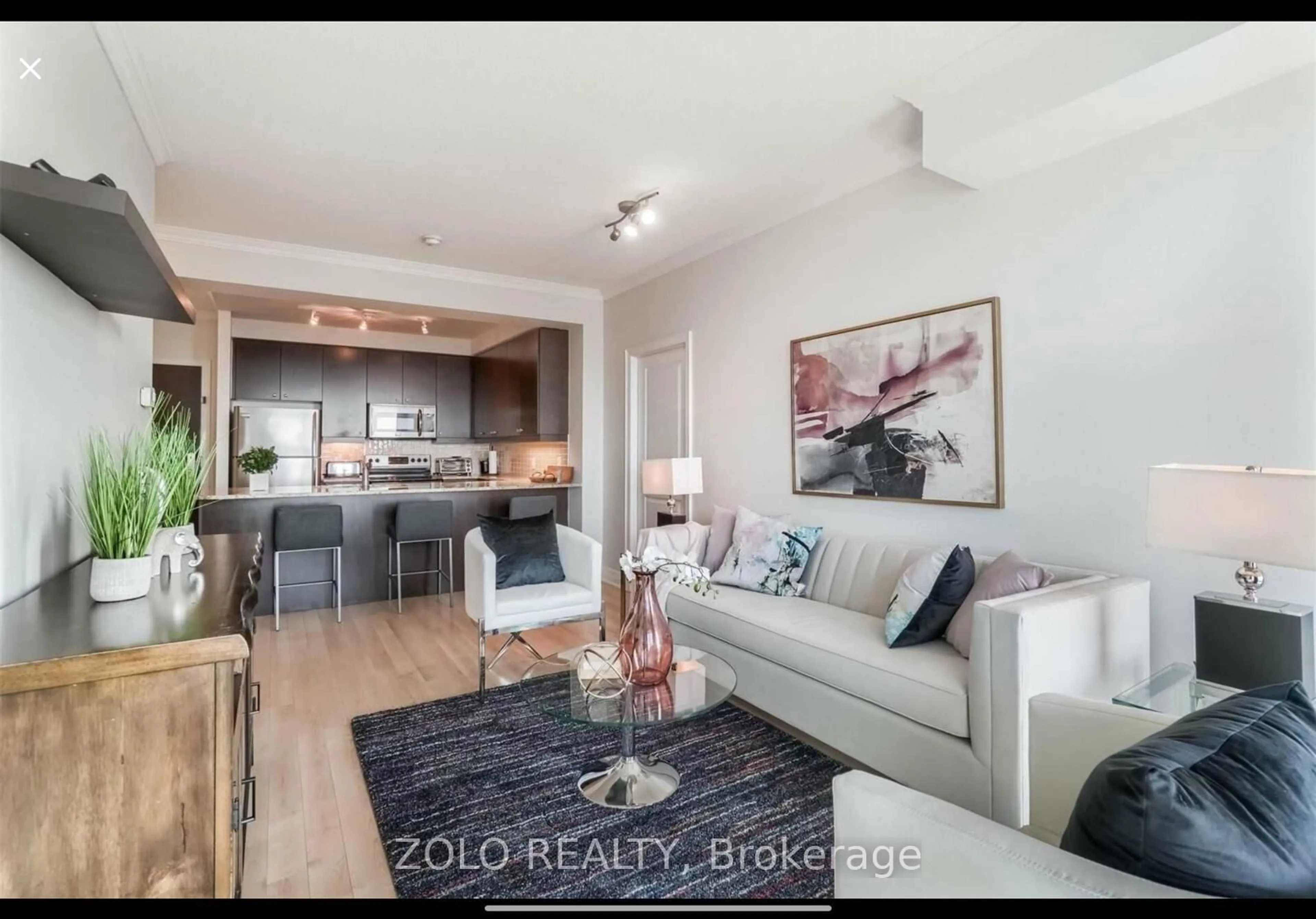Living room with furniture, wood/laminate floor for 100 John St #1905, Brampton Ontario L6W 0A8