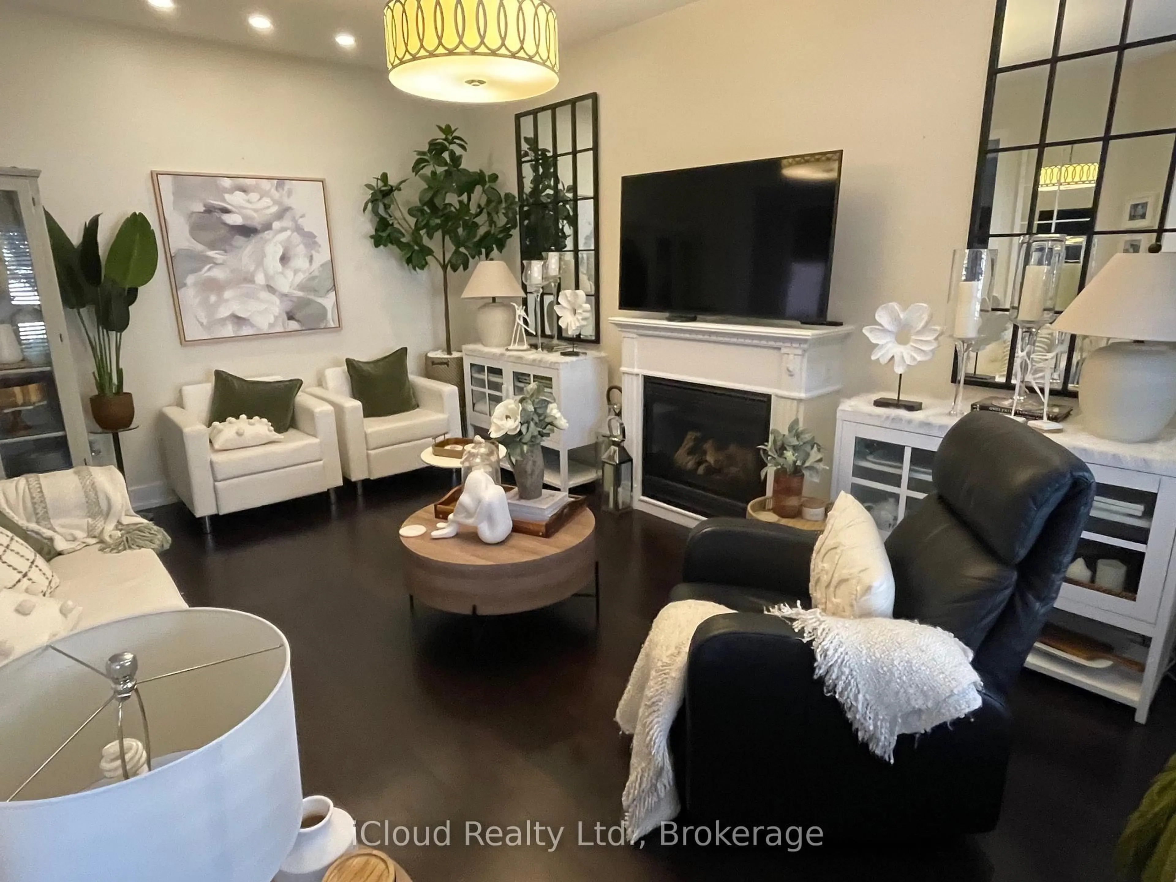 Living room with furniture, wood/laminate floor for 22 Fallgate Dr, Brampton Ontario L6X 0R5