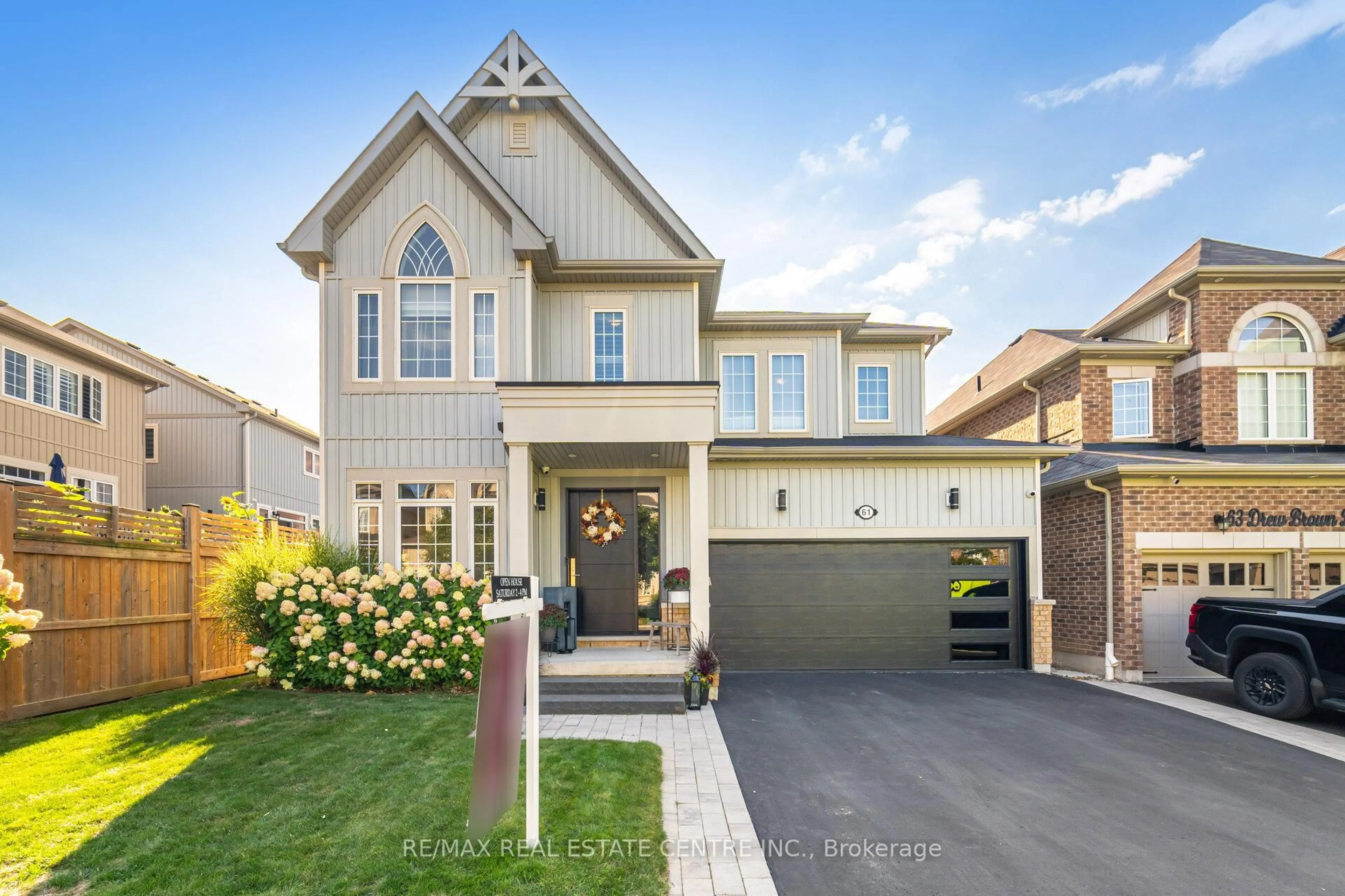 Home with vinyl exterior material, street for 61 Drew Brown Blvd, Orangeville Ontario L9W 6Z4