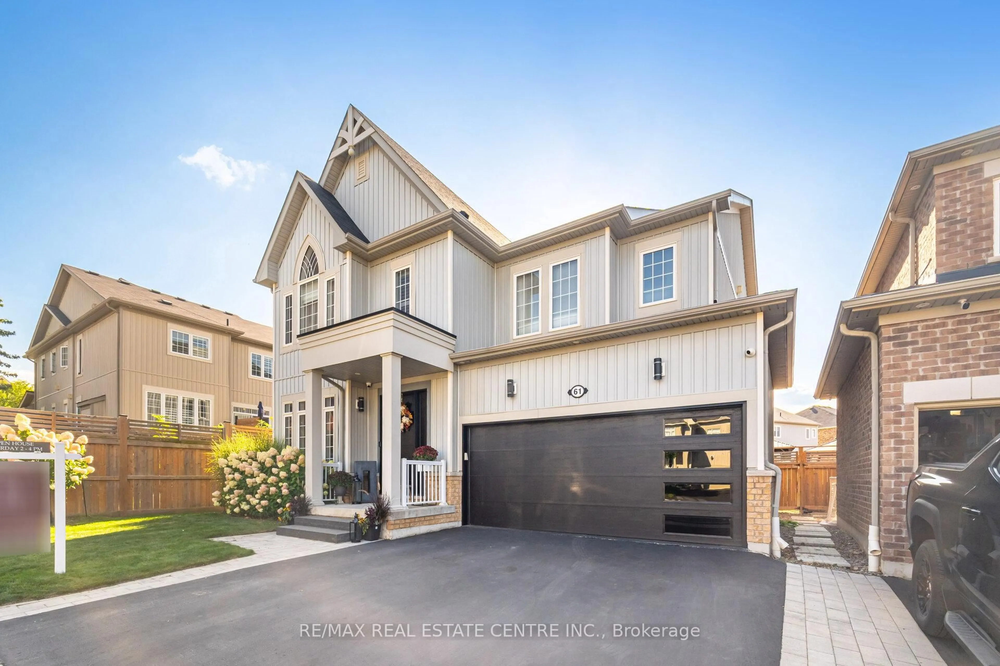 Home with brick exterior material, street for 61 Drew Brown Blvd, Orangeville Ontario L9W 6Z4