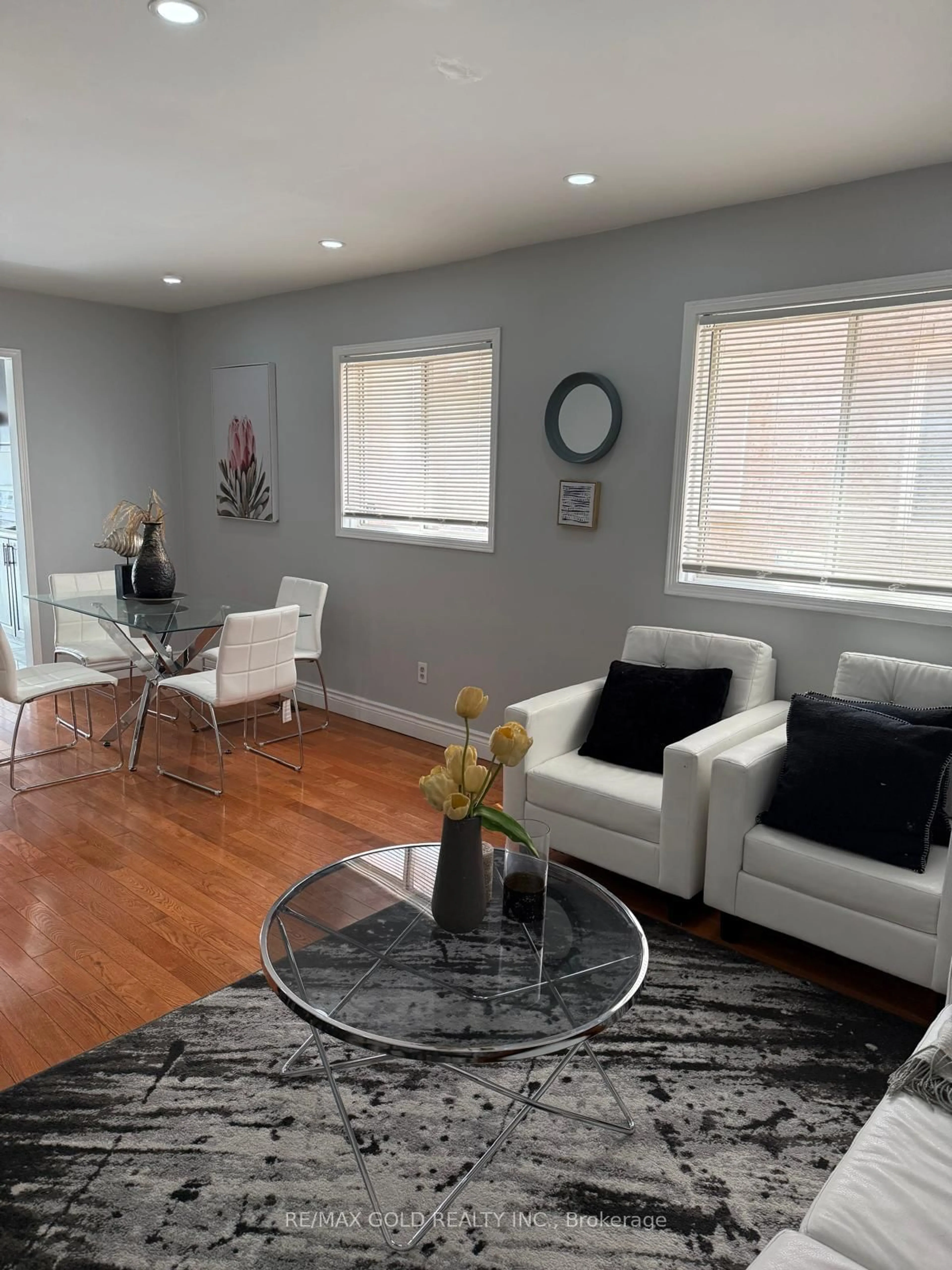 Living room with furniture, wood/laminate floor for 65 Cedarwood Cres, Brampton Ontario L6X 4J9