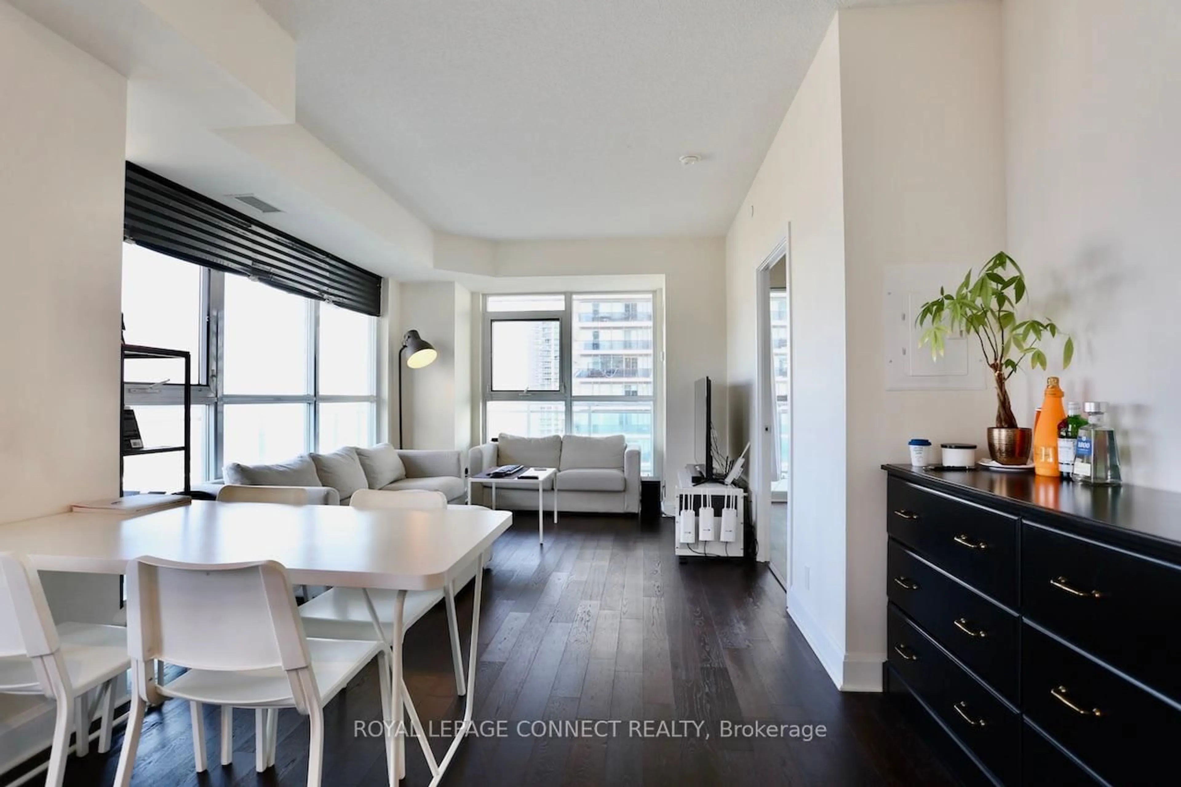 Living room with furniture, wood/laminate floor for 33 Shore Breeze Dr #2504, Toronto Ontario M8V 1A1
