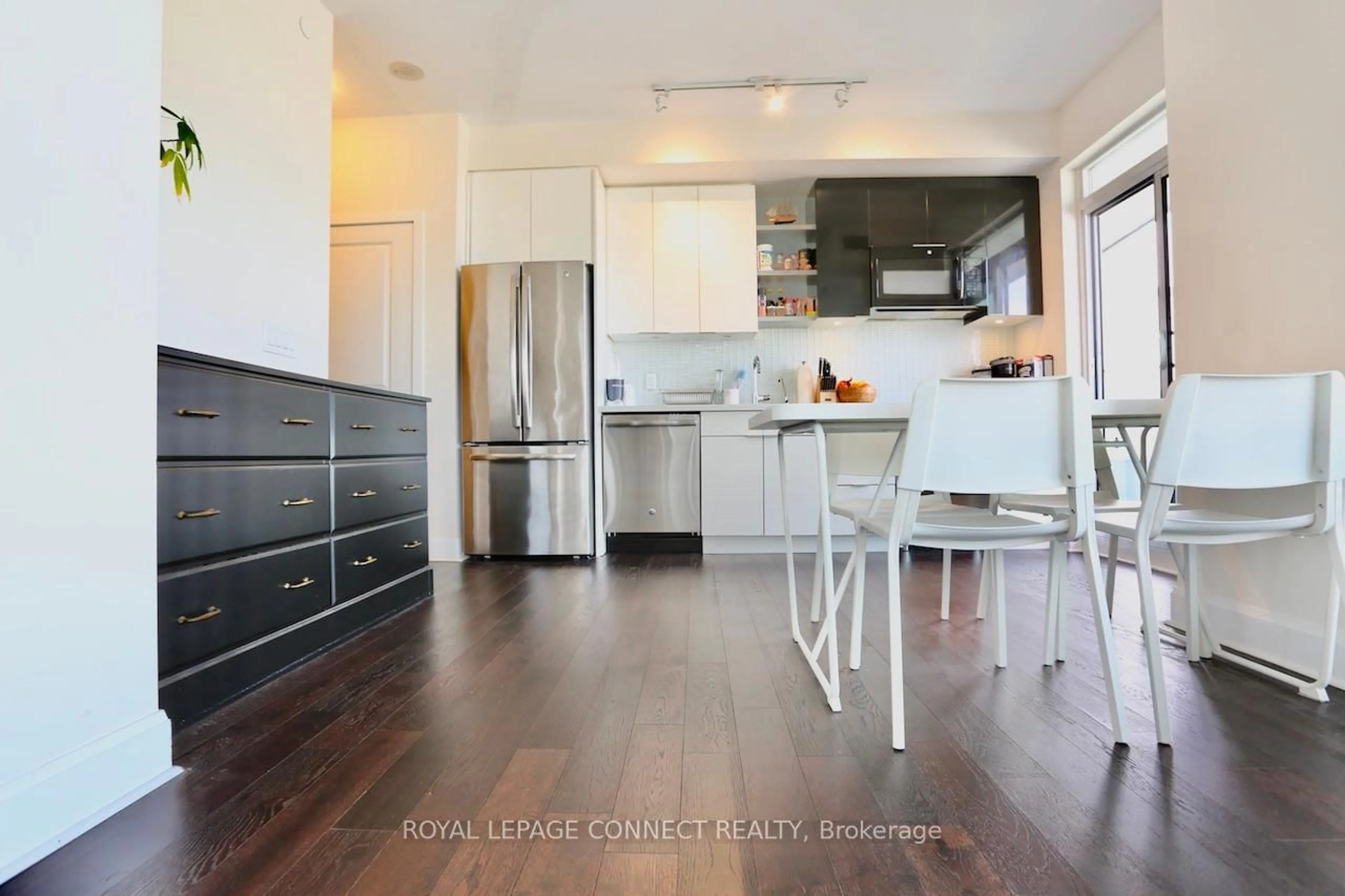 Open concept kitchen, wood/laminate floor for 33 Shore Breeze Dr #2504, Toronto Ontario M8V 1A1