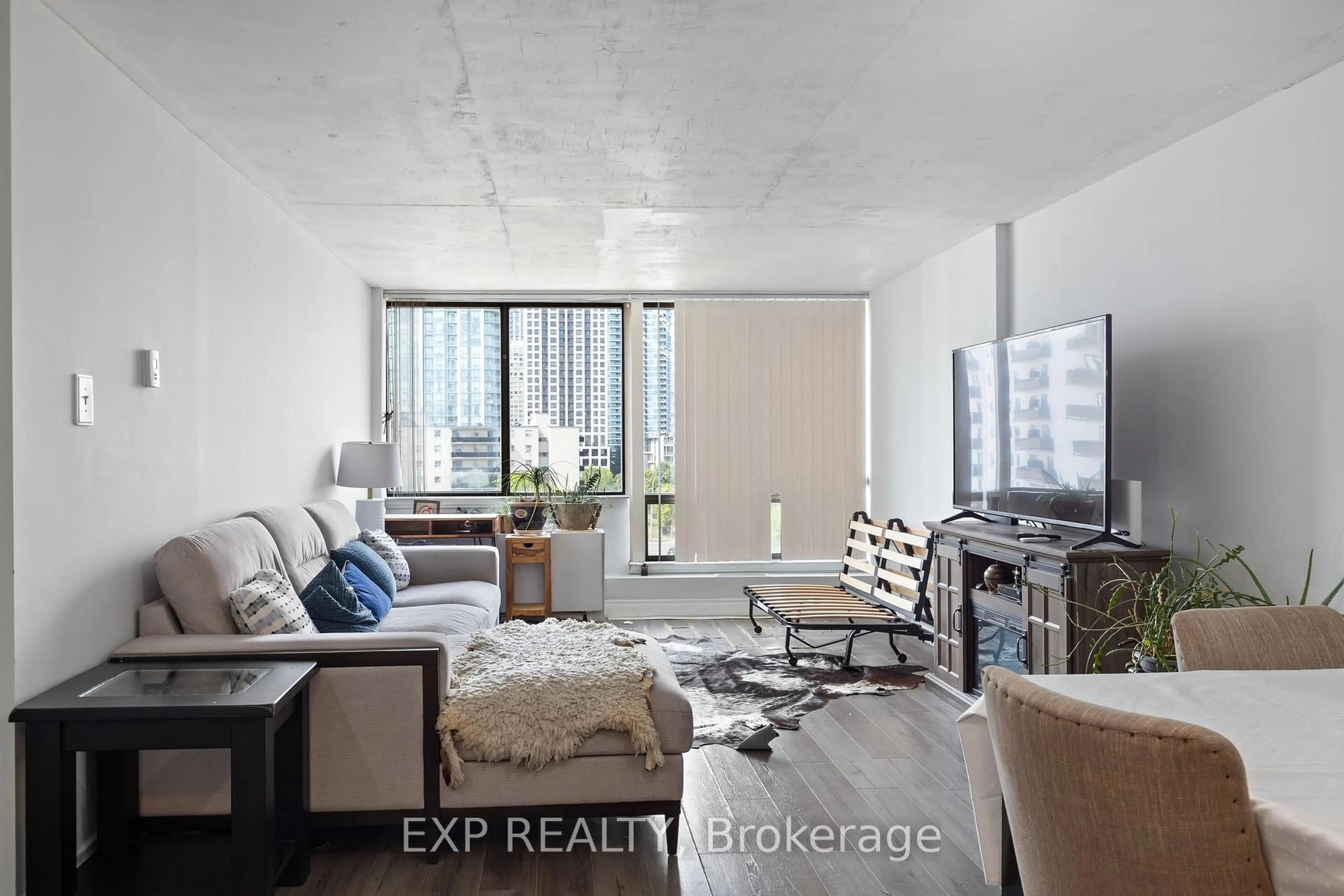 Living room with furniture, unknown for 25 Fairview Rd #707, Mississauga Ontario L5B 3Y8