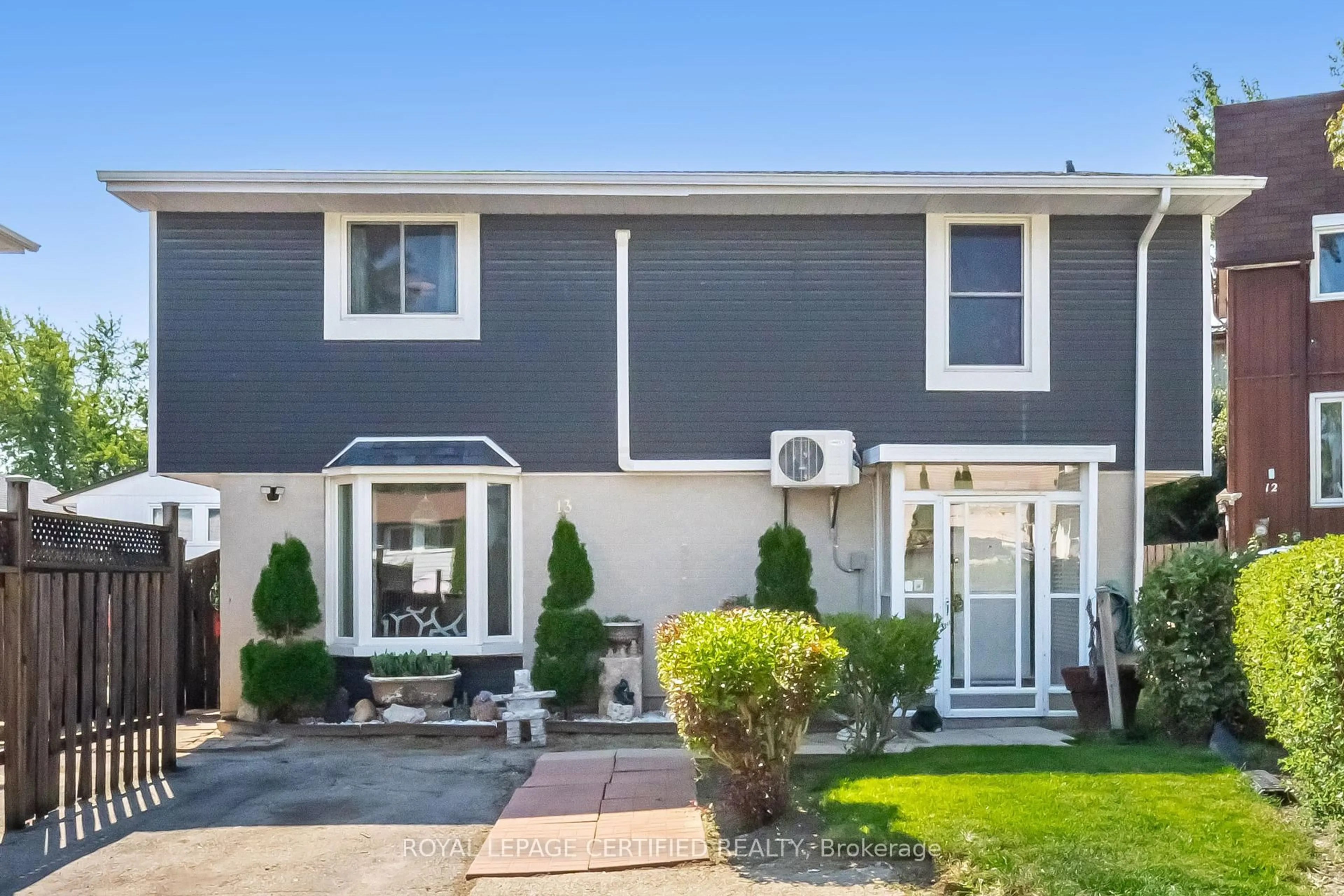 Home with vinyl exterior material, street for 13 Hilldowntree Tr, Brampton Ontario L6S 1P7