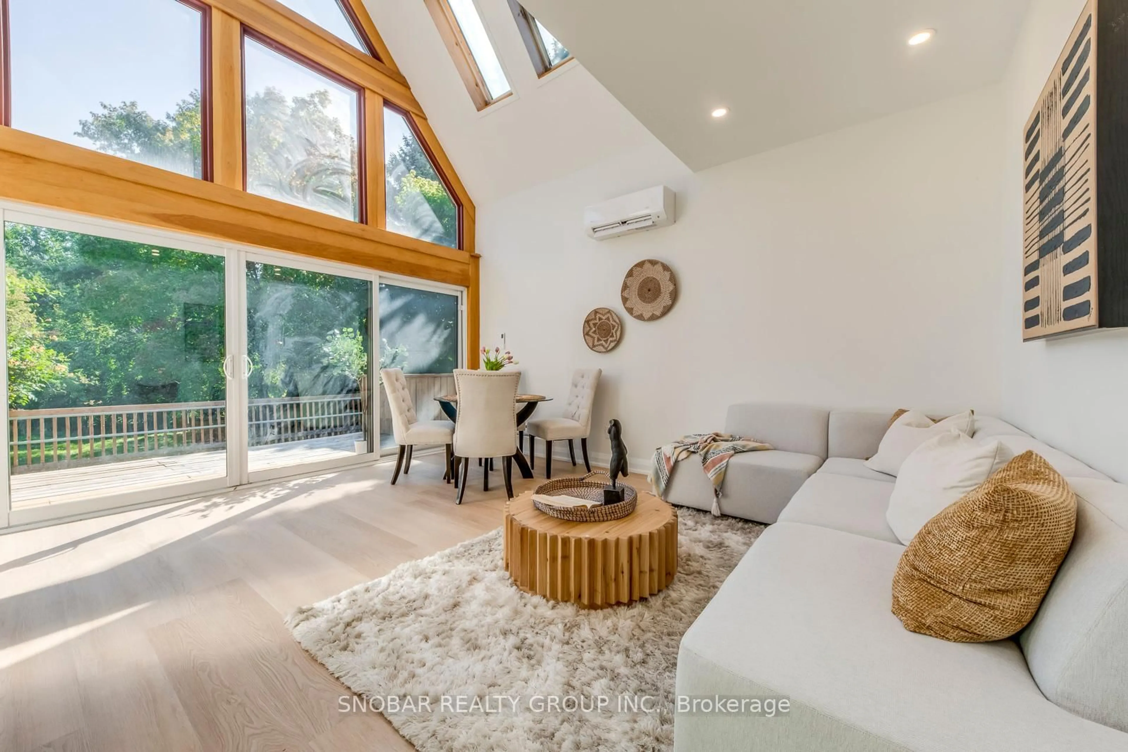 Living room with furniture, wood/laminate floor for 9 Berry Creek Dr, Toronto Ontario M9W 4A1