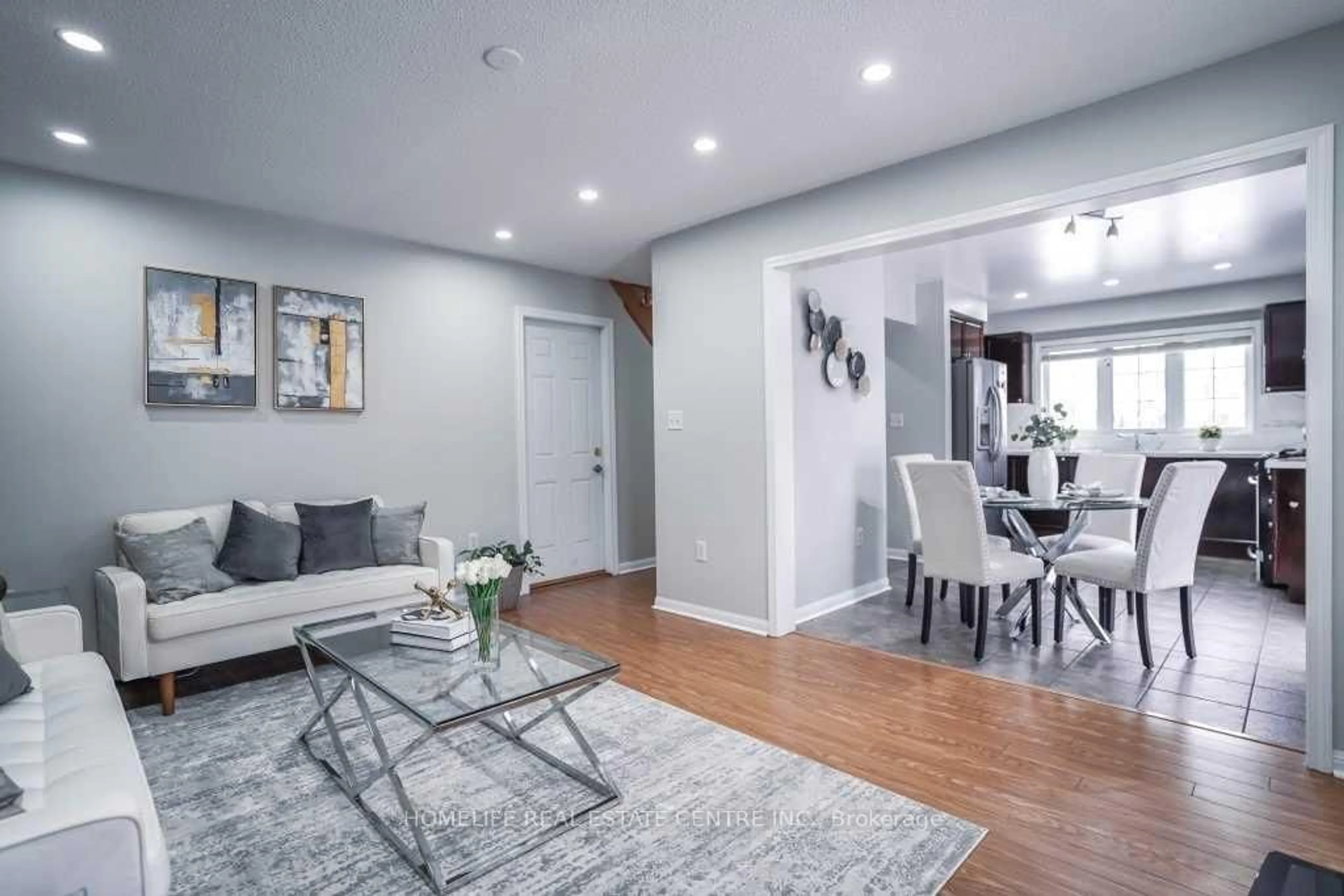 Living room with furniture, wood/laminate floor for 2 Chudleigh Ave, Brampton Ontario L6X 0N1