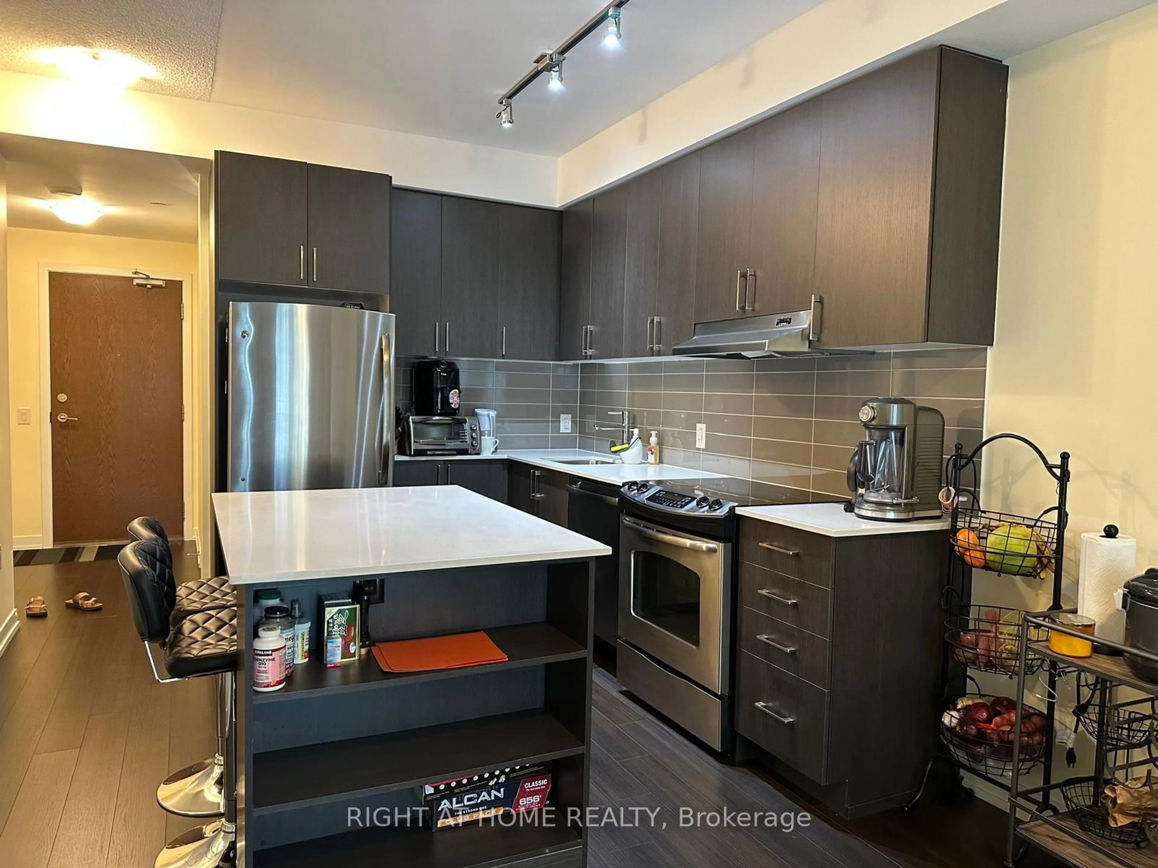 Open concept kitchen, wood/laminate floor for 2560 Eglinton Ave #1803, Mississauga Ontario L5M 0Y3