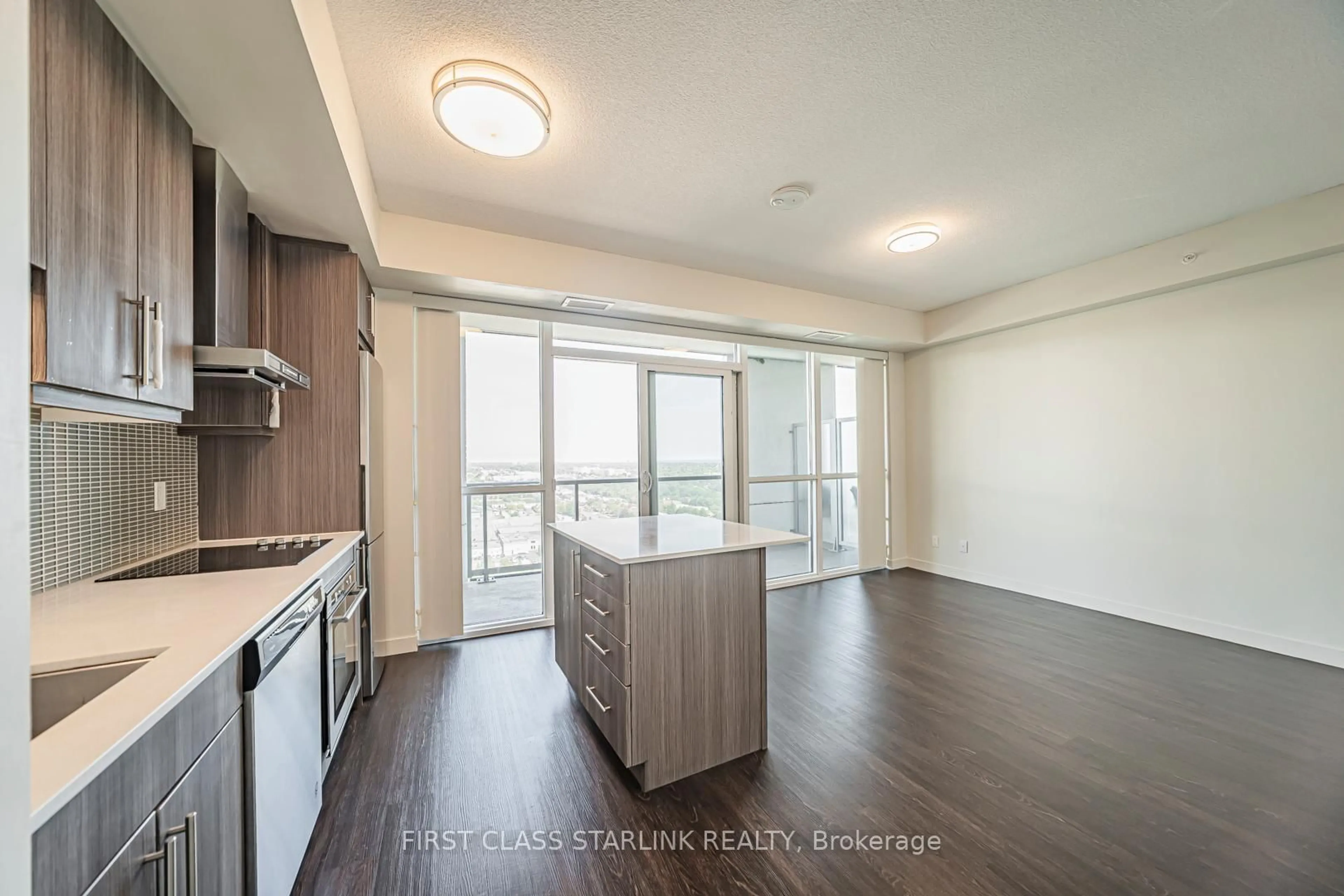 Open concept kitchen, wood/laminate floor for 2087 Fairview St #2202, Burlington Ontario L7R 0E5