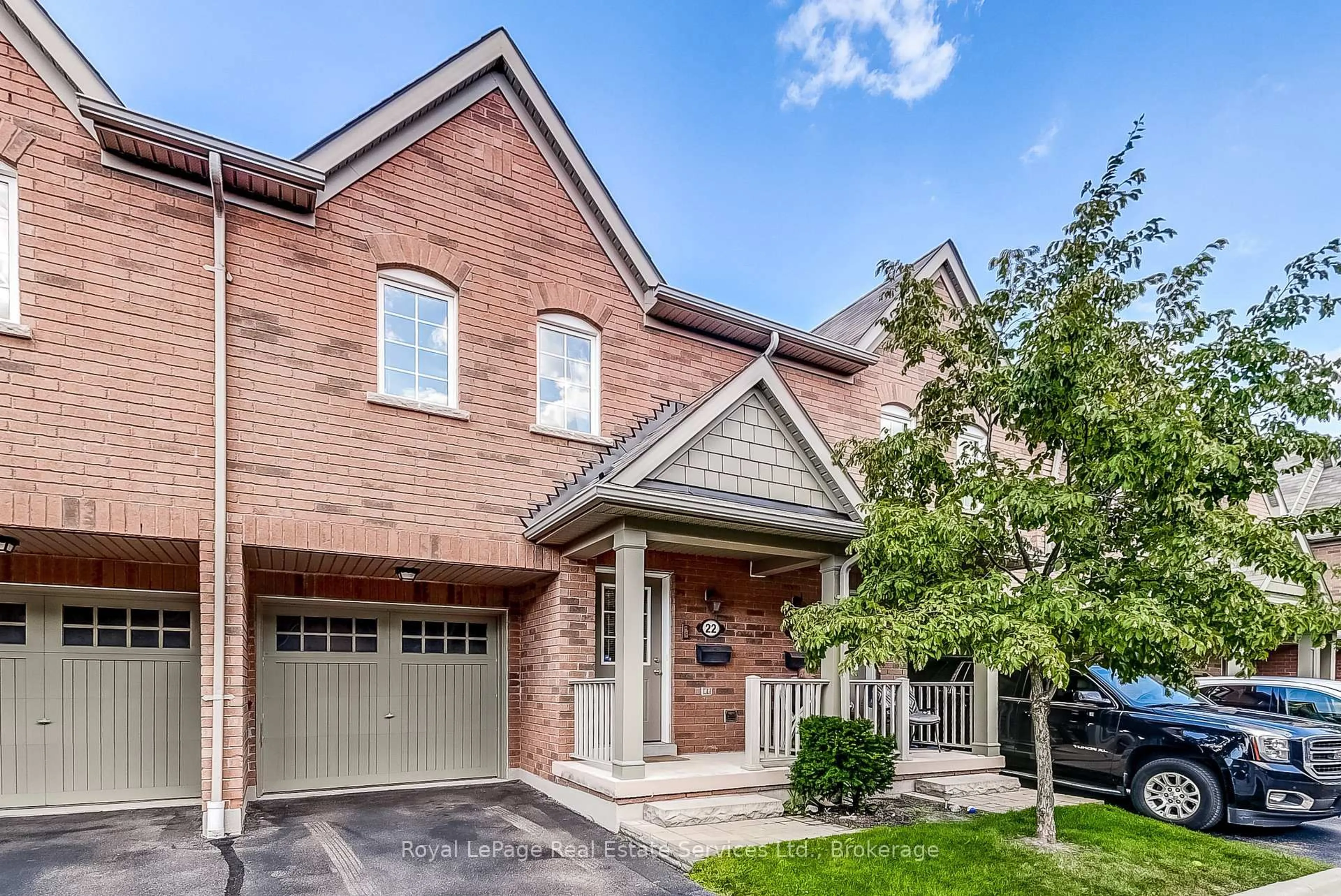 Home with brick exterior material, street for 233 Duskywing Way #22, Oakville Ontario L6L 0C5