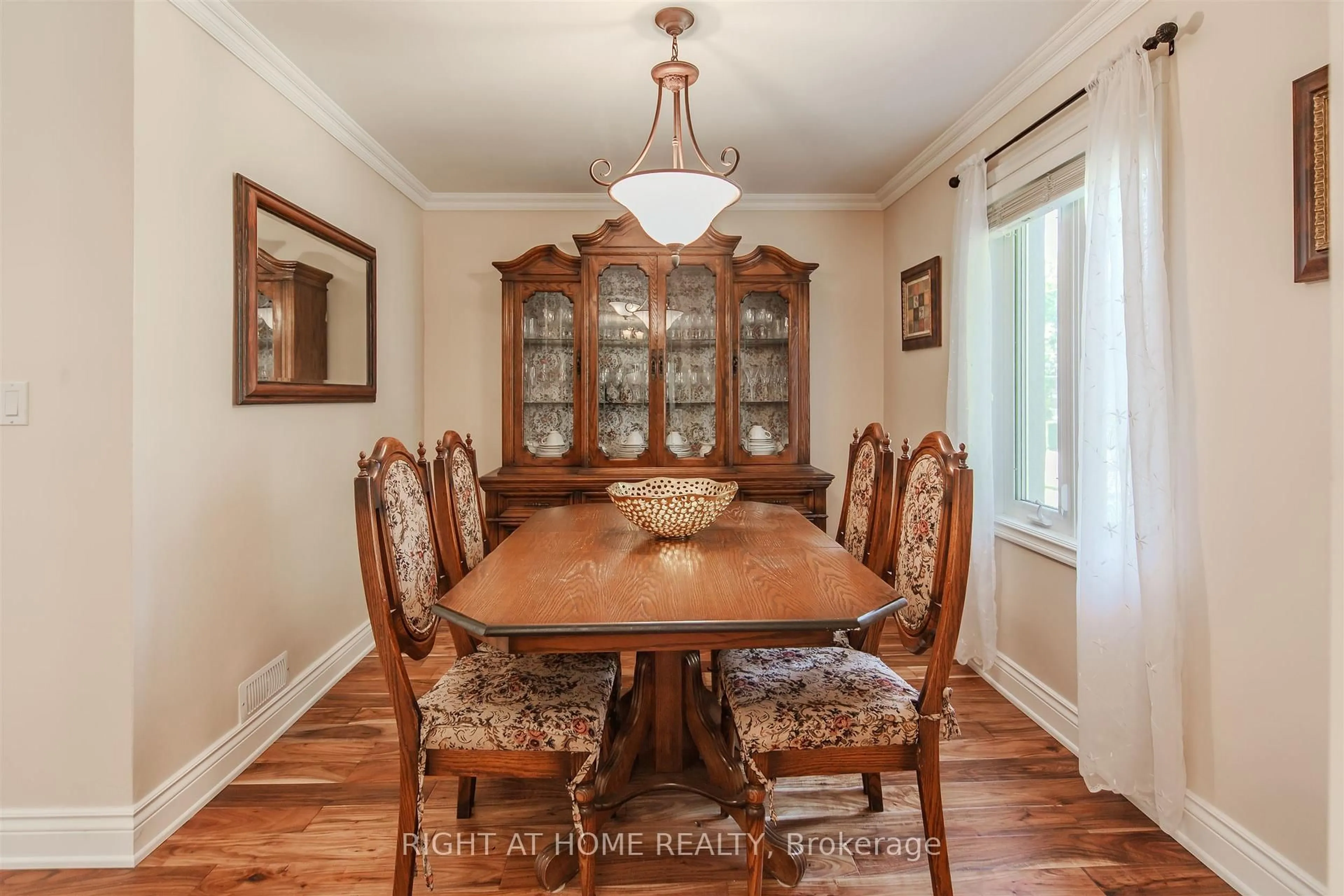Dining room, wood/laminate floor for 7 Adele Ave, Toronto Ontario M3L 1J2