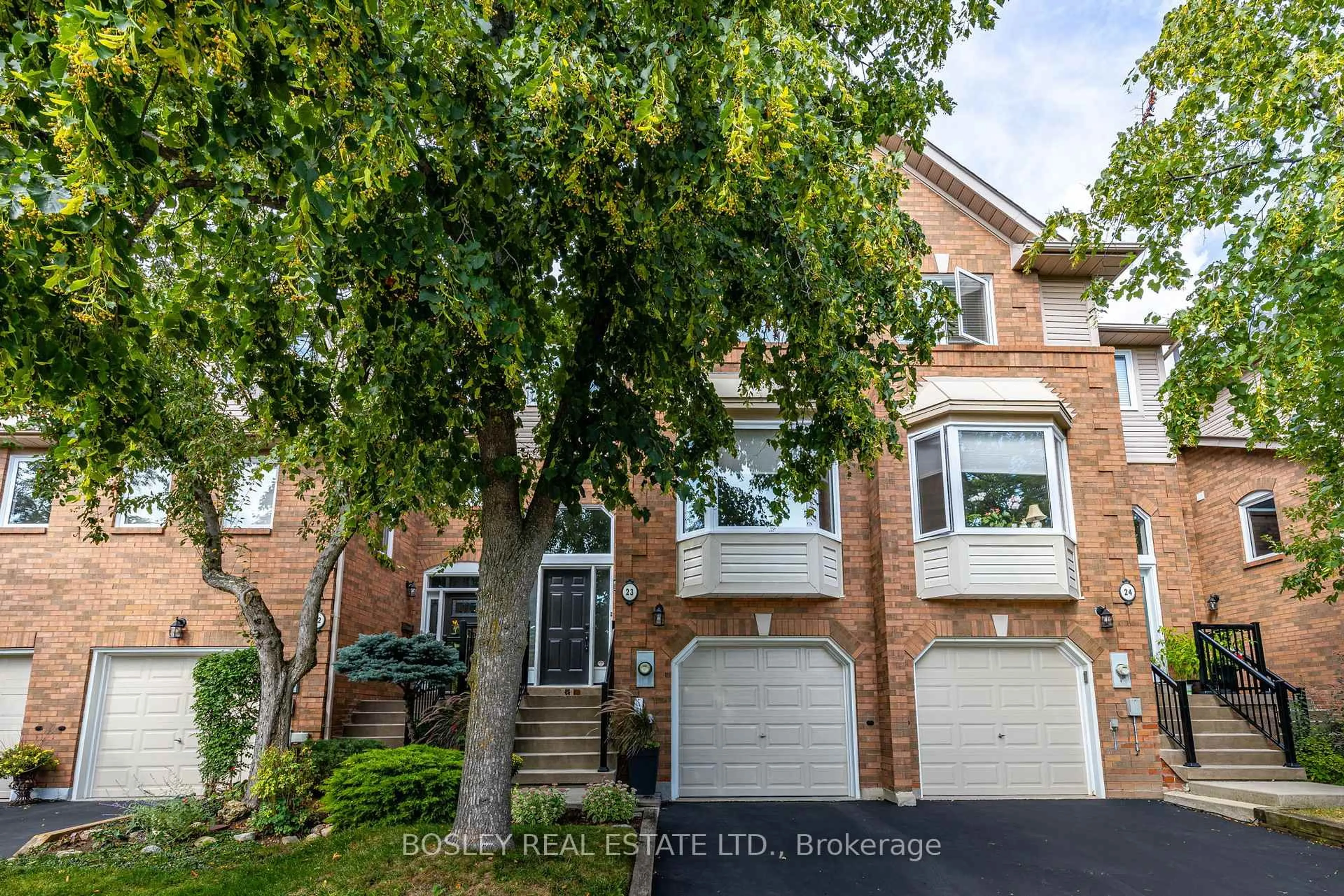 Home with brick exterior material, street for 2051 Merchants Gate #23, Oakville Ontario L6M 3H6