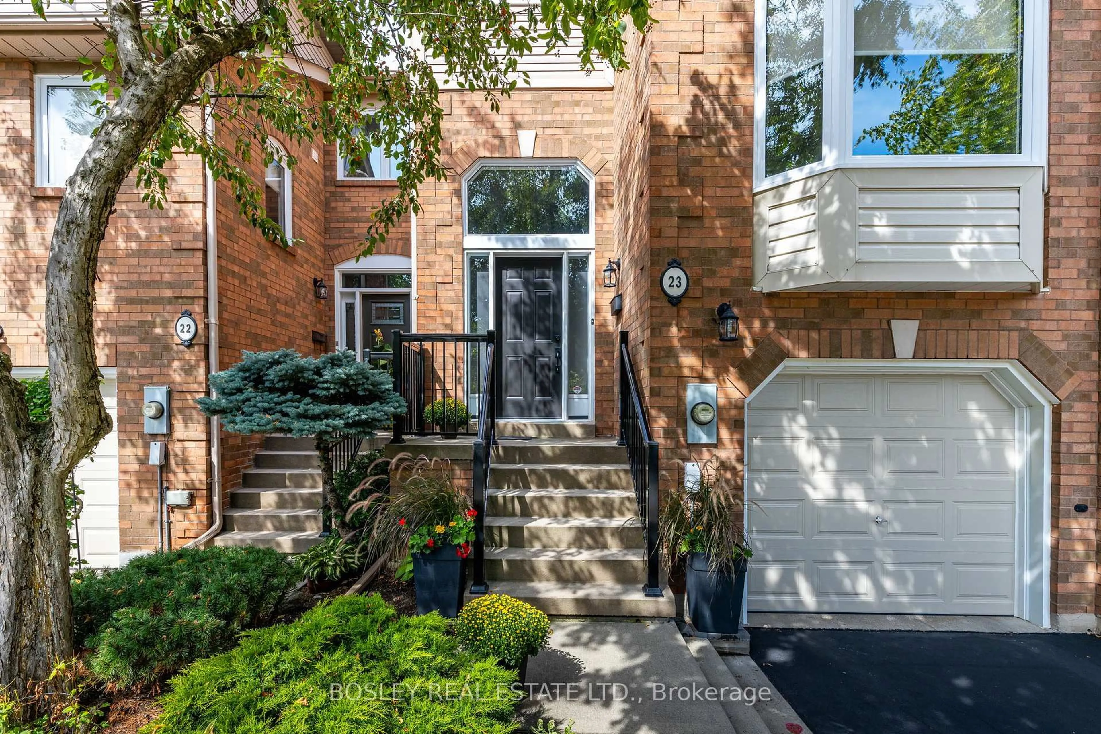 Home with brick exterior material, street for 2051 Merchants Gate #23, Oakville Ontario L6M 3H6