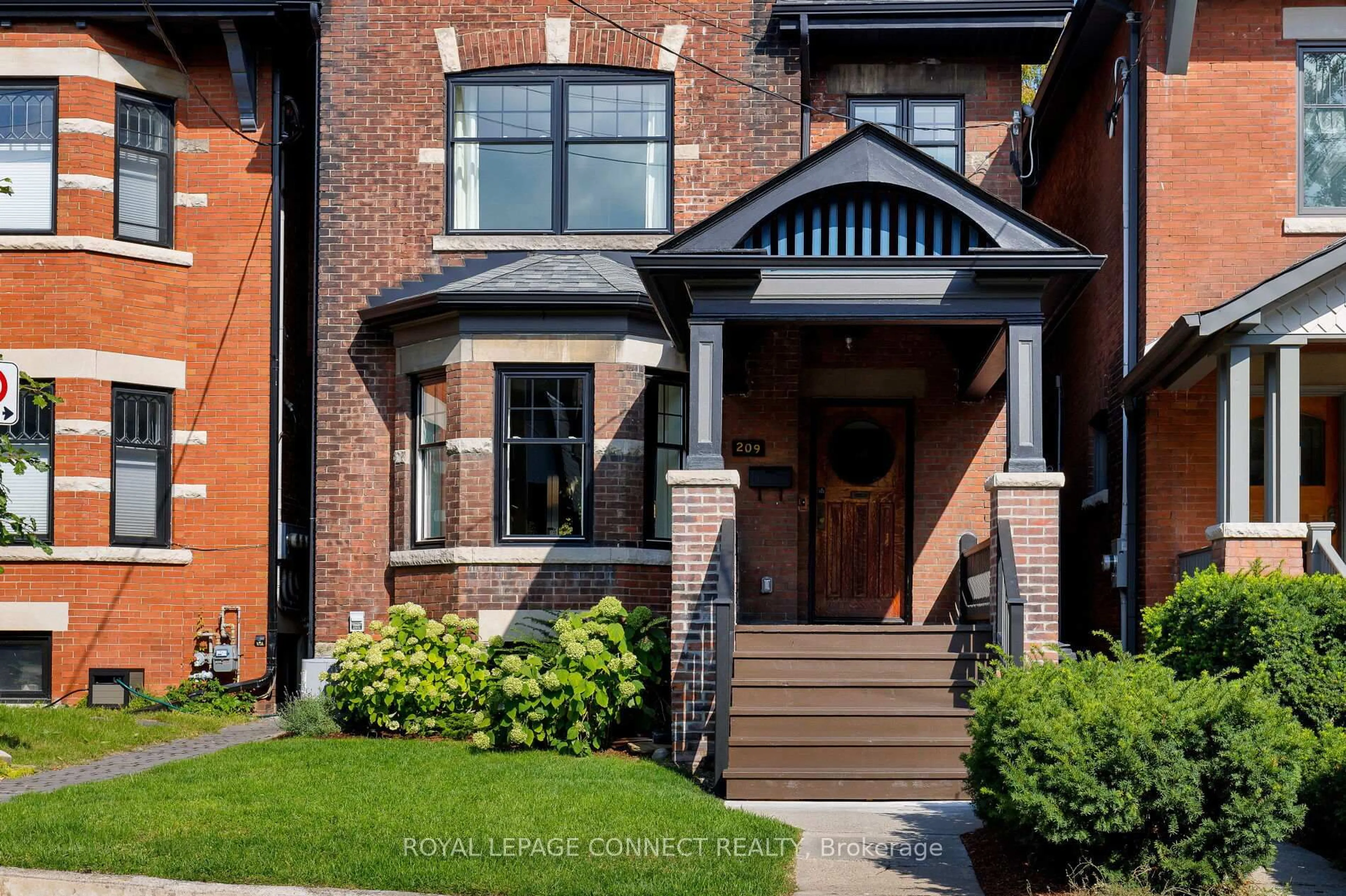 Home with brick exterior material, street for 209 Indian Rd, Toronto Ontario M6R 2W7