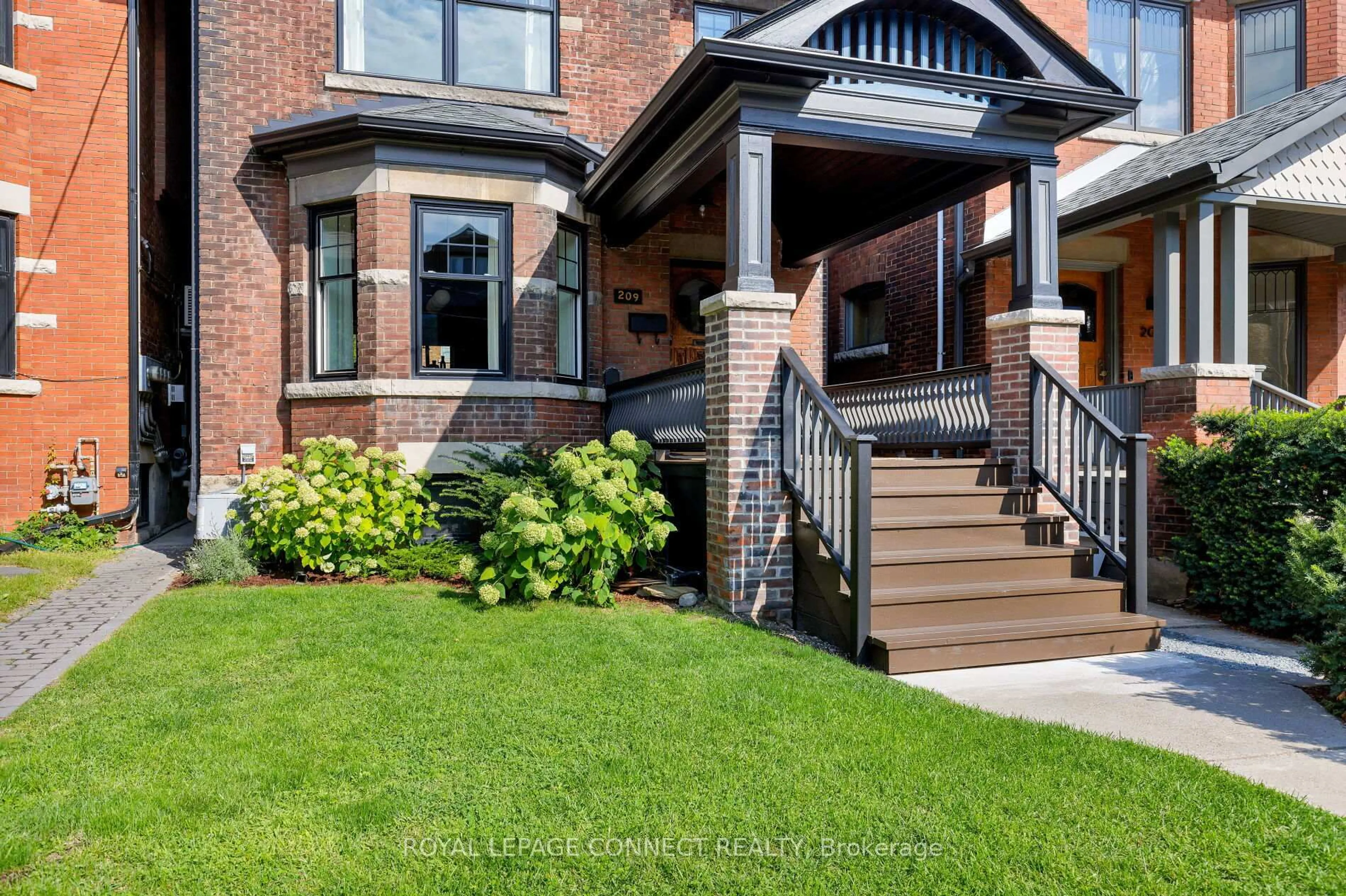 Home with brick exterior material, street for 209 Indian Rd, Toronto Ontario M6R 2W7