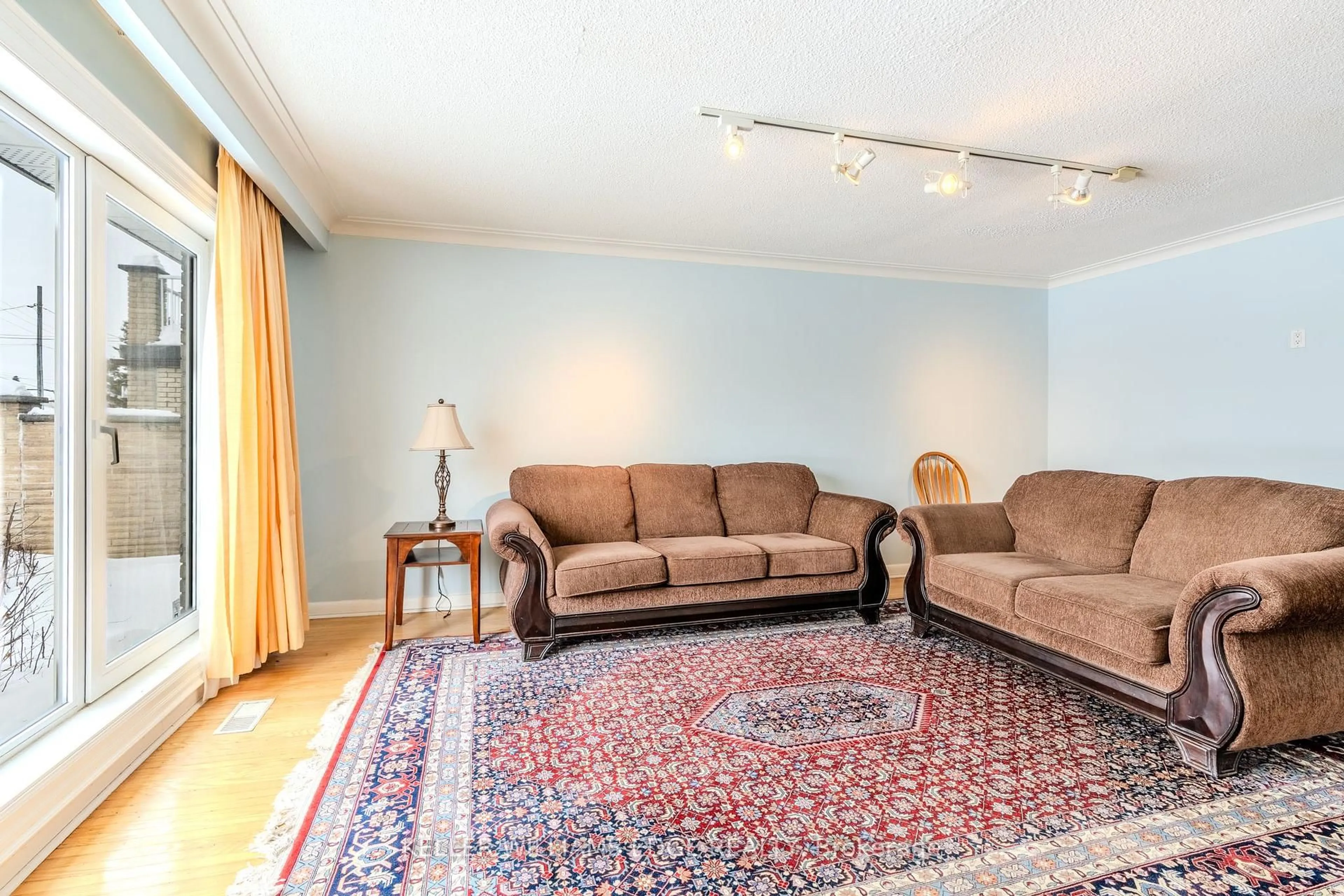 Living room with furniture, carpet floor for 57 Apted Ave, Toronto Ontario M9L 2P2