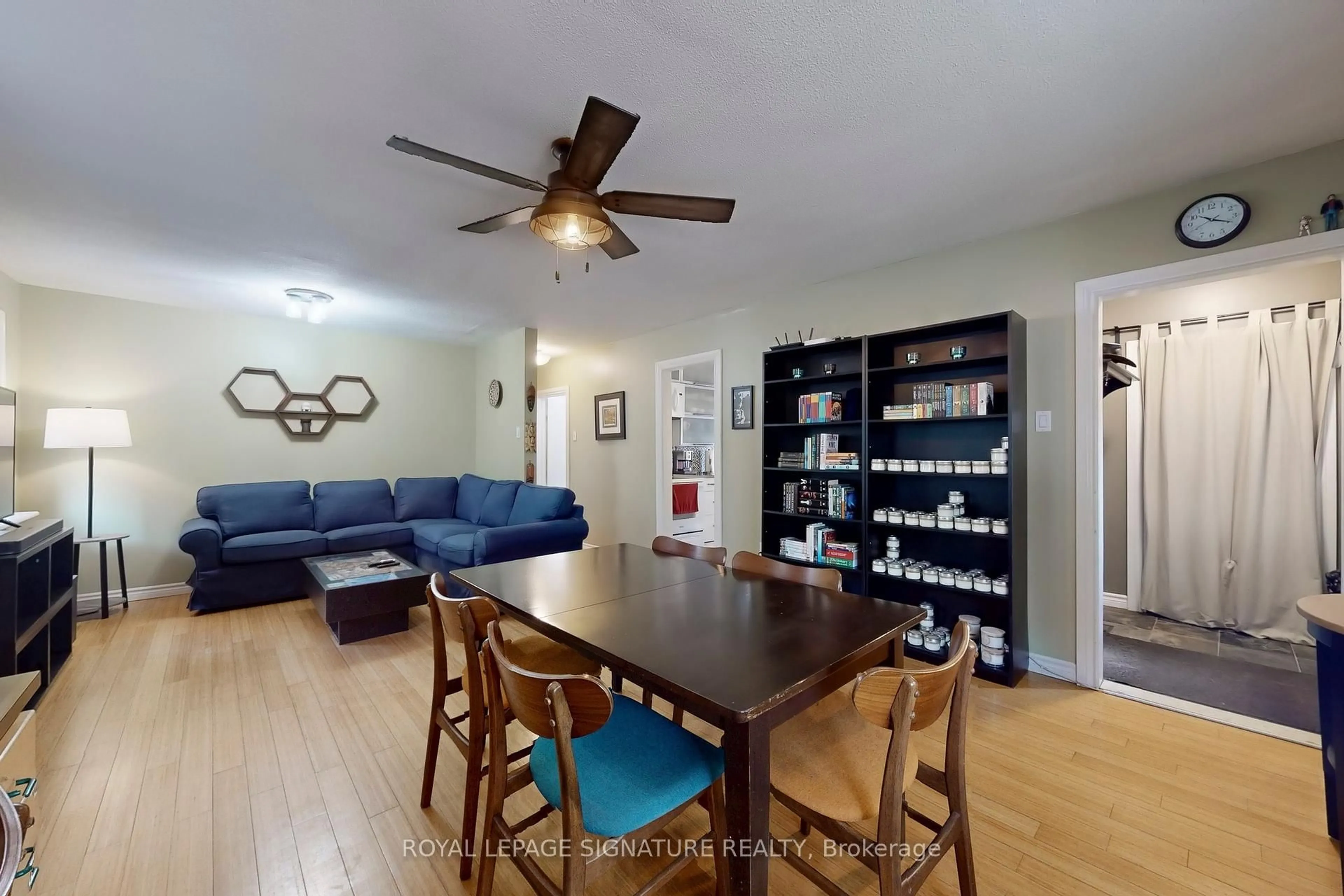 Living room with furniture, wood/laminate floor for 871 Tenth St, Mississauga Ontario L5E 1S8