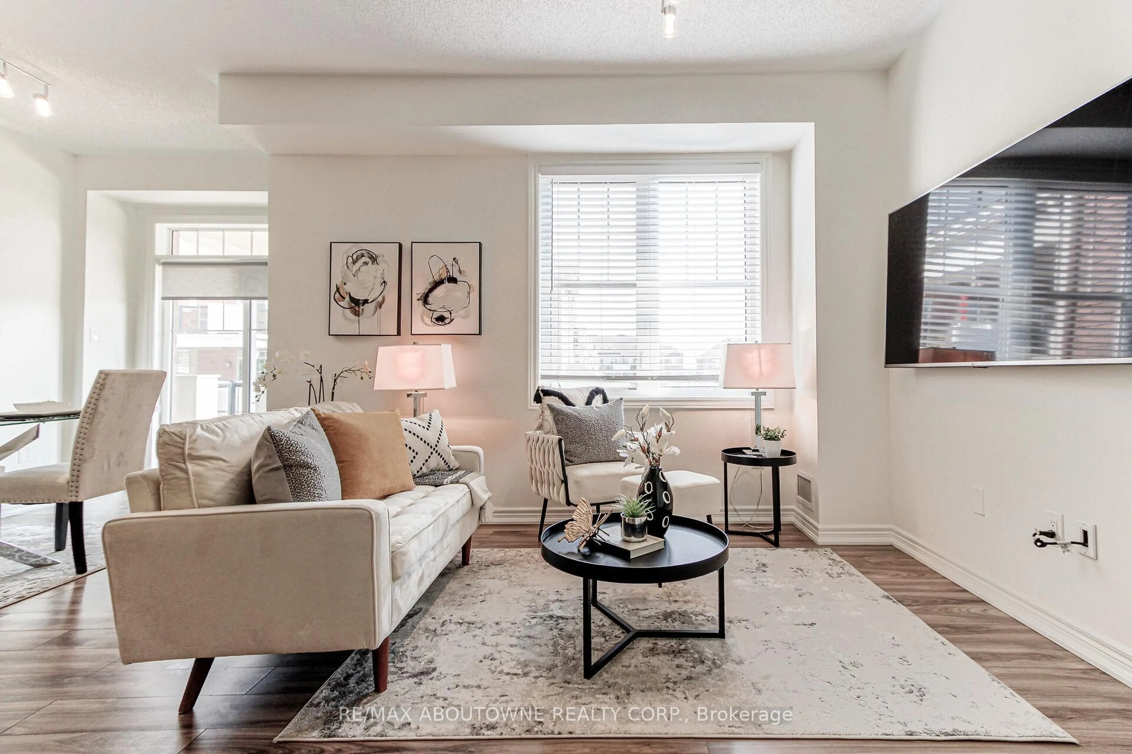 Living room with furniture, unknown for 2339 Sawgrass Dr #206, Oakville Ontario L6H 0L1
